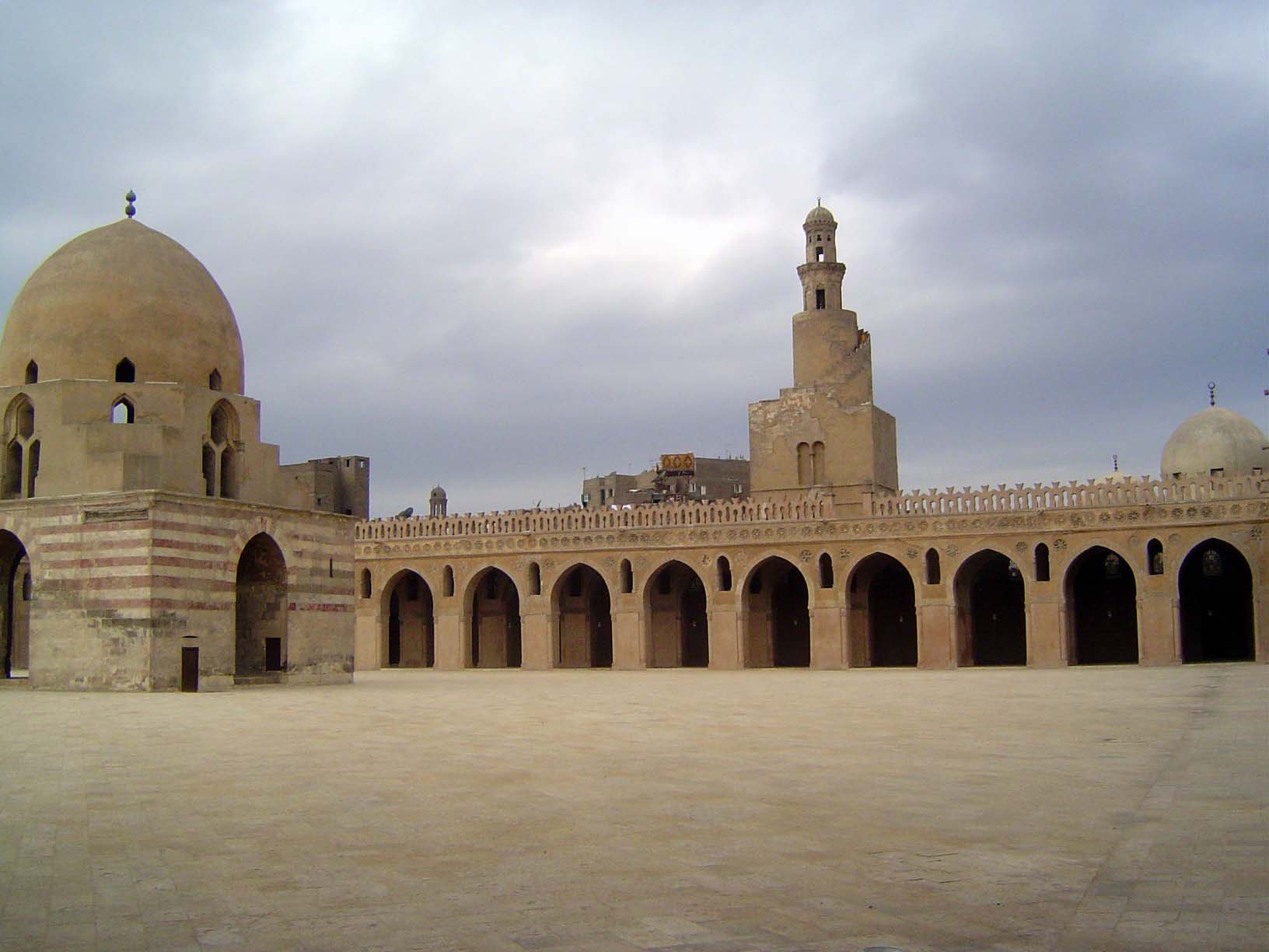 Inside, there's a courtyard based on the still earlier mosque at Samarra. The domed fountain and the mosque with its very unusual external s