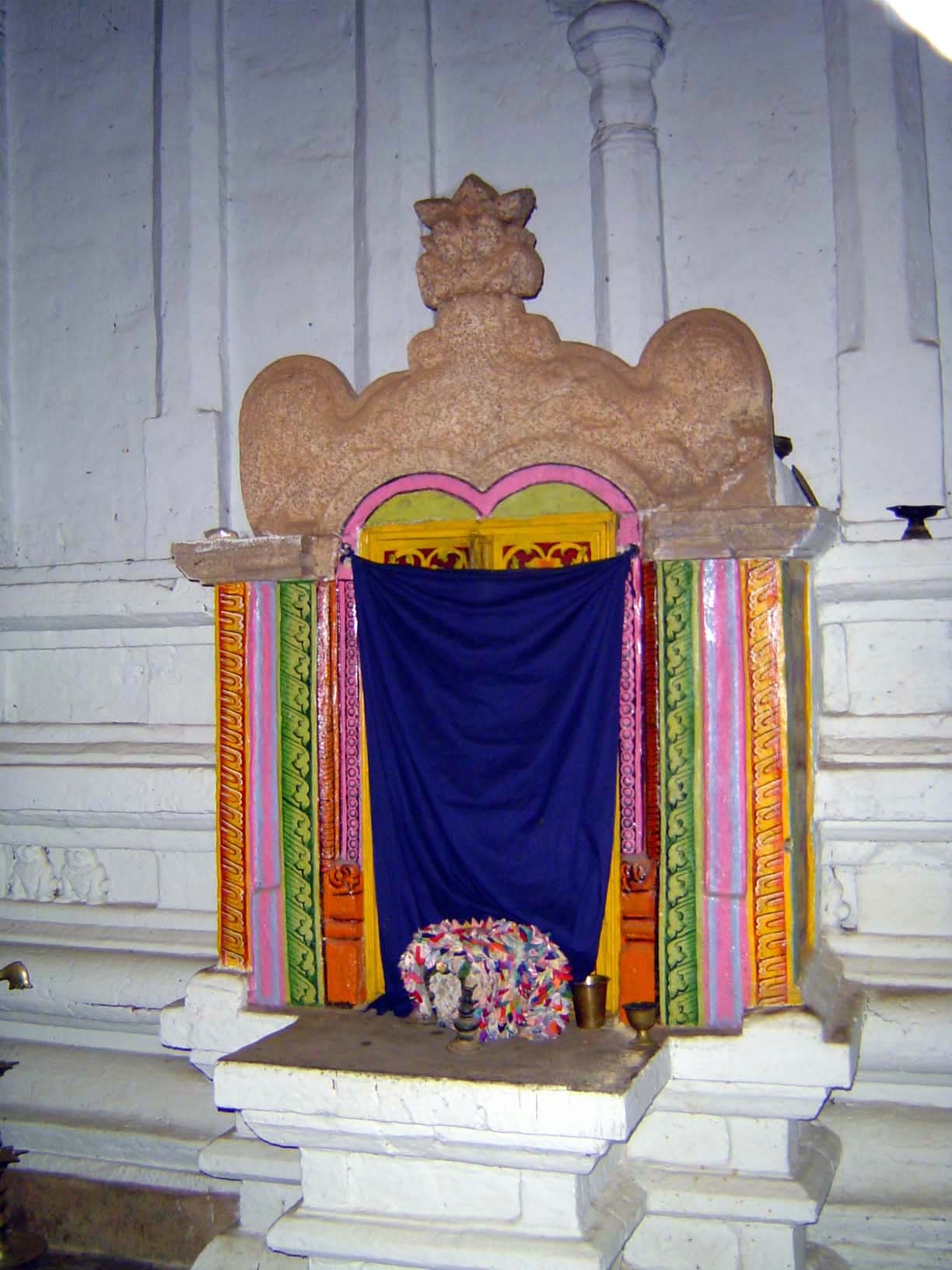 When we entered we saw Vishnu and this tiny shrine. It may be small, but it's not insignificant. It's the shrine of Kumara Bandara, a danger