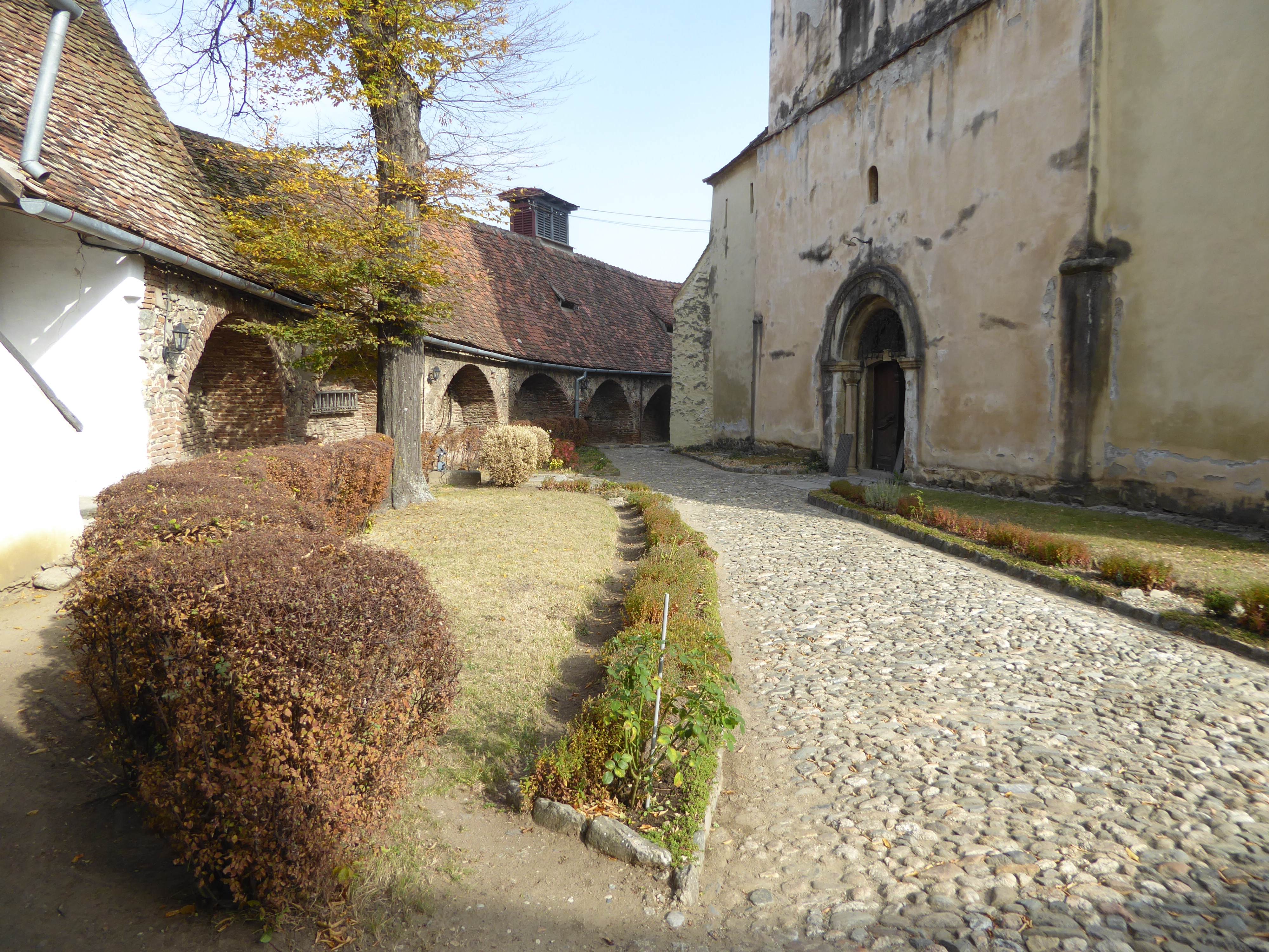 The church is wrapped in its own wall, and the wall is divided into cells where villagers could live, family by family, in the event of a si
