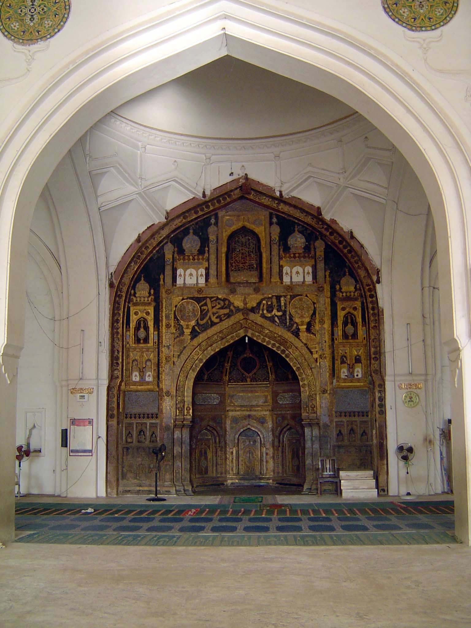 The mihrab has an inscription reading, "This gilding and ornamental work was done by order of the Sultan Muhammad Adil Shah, A.H. 1045." Tha