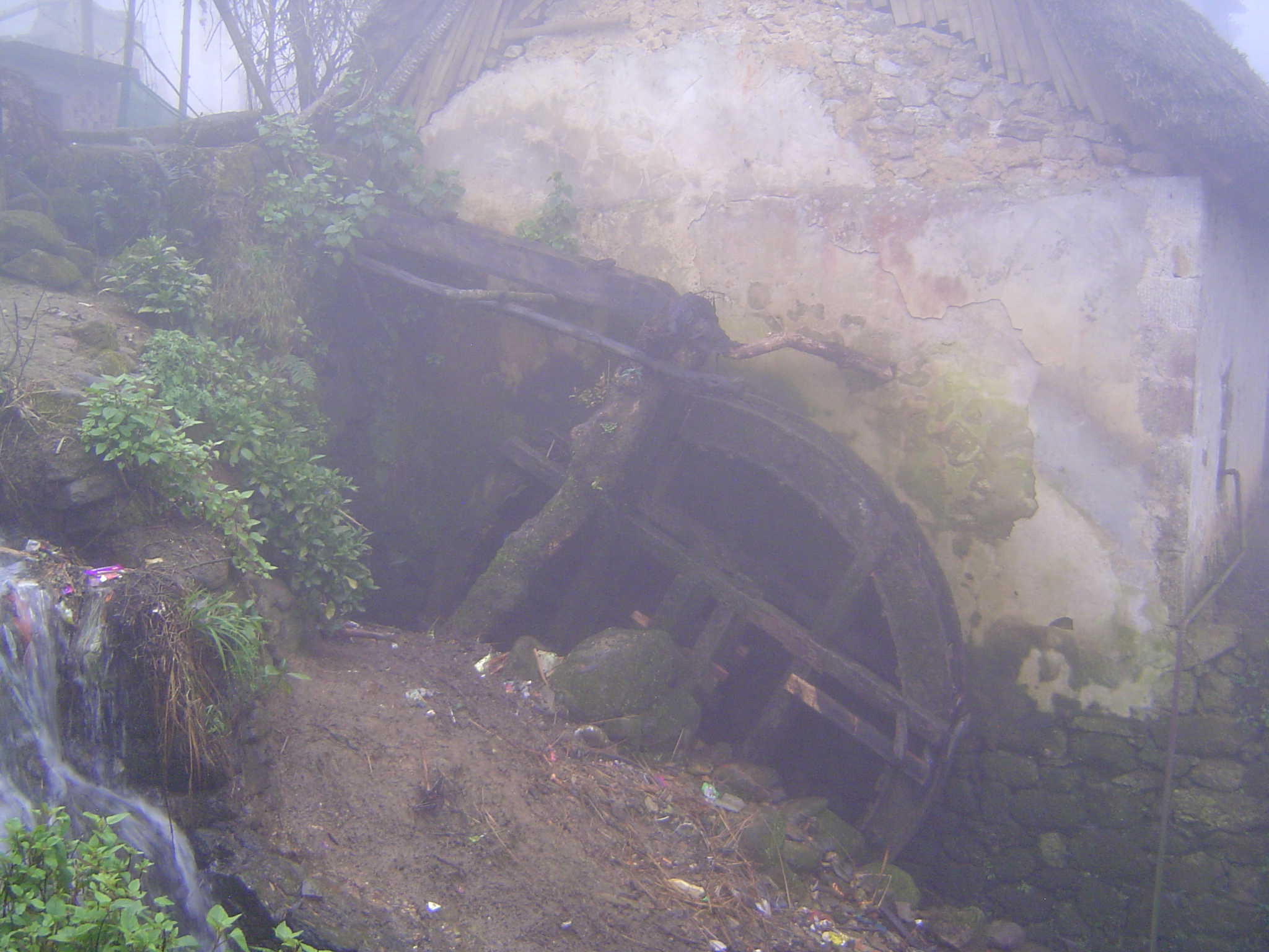 Outside the house, there's a waterwheel and, inside the building, a rice mill.