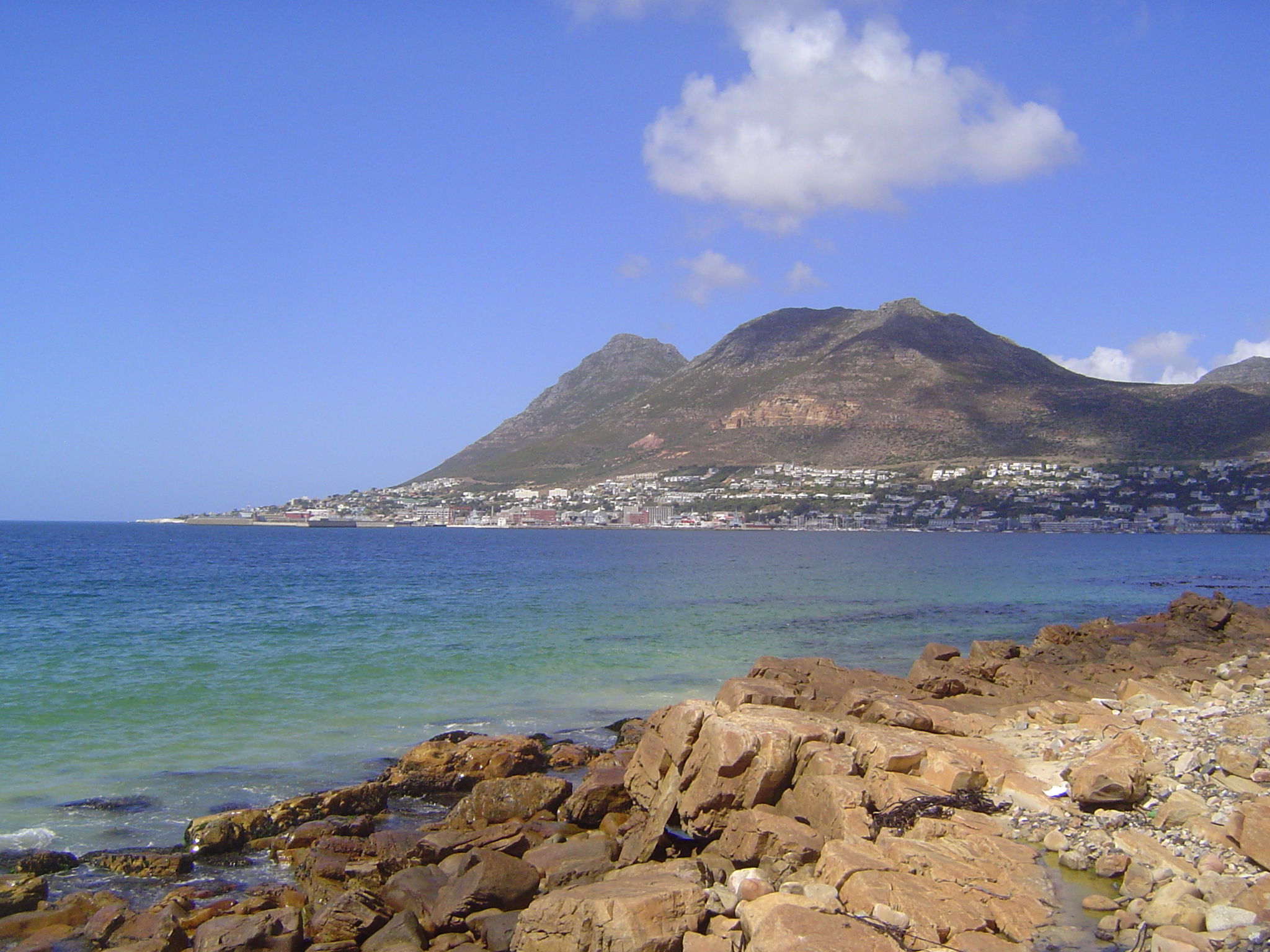 A few miles down the coast we're looking south at False Bay, a shallow indentation that, despite its limitations, was especially important b