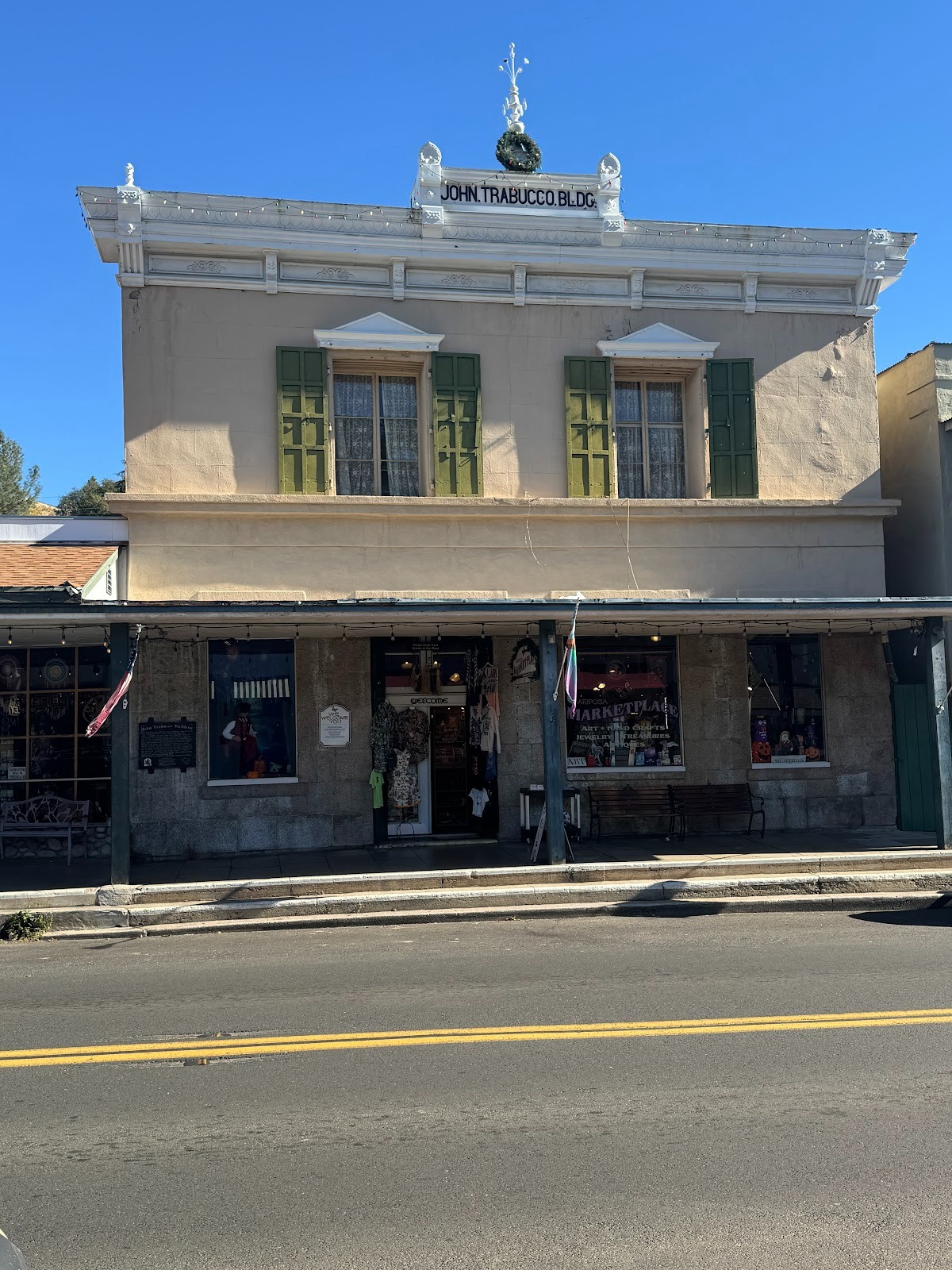 Next door there's another arts-and-crafts shop. The building opened as John Trabucco's "cheap cash" store.  It stayed in business from 1896