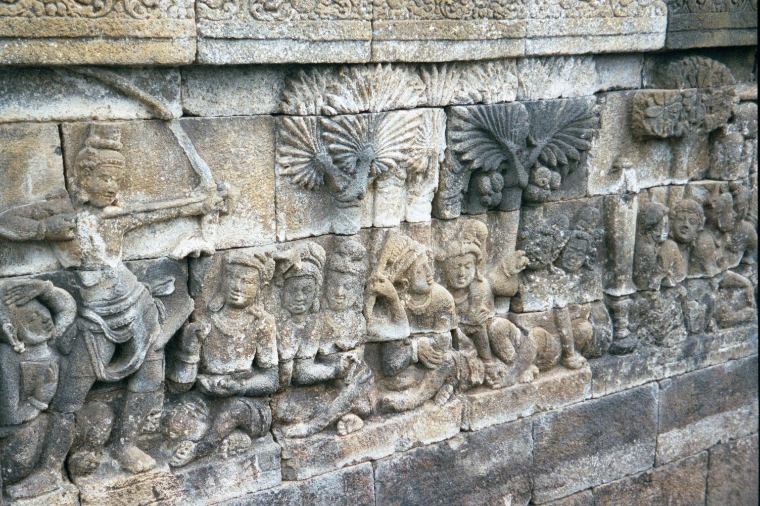 Manohara's father isn't pleased and orders Sudhana to shoot an arrow through seven trees and into a gold post. Done!