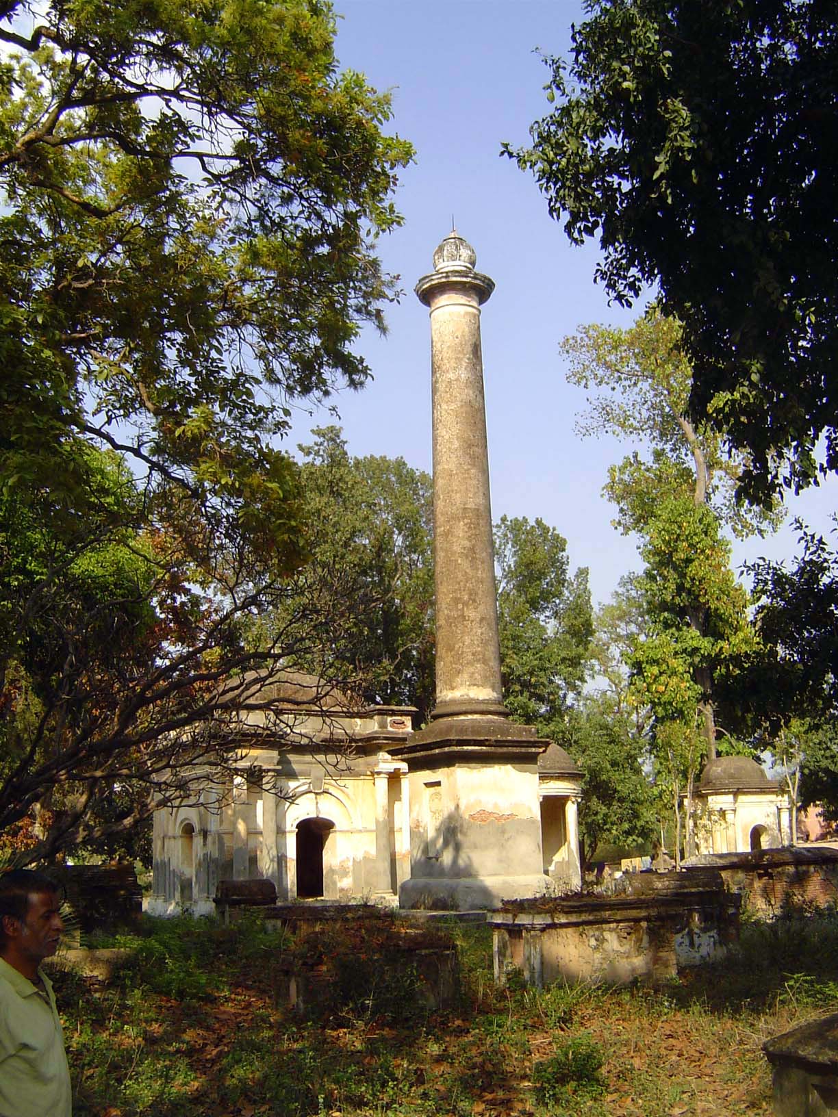 A few blocks away is the cemetery. Who's under the column?
