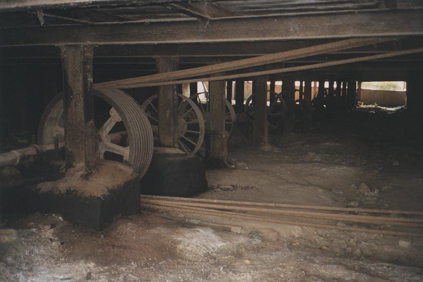 Down below, elaborate belting connected the steam engine to the mill's circular saws.