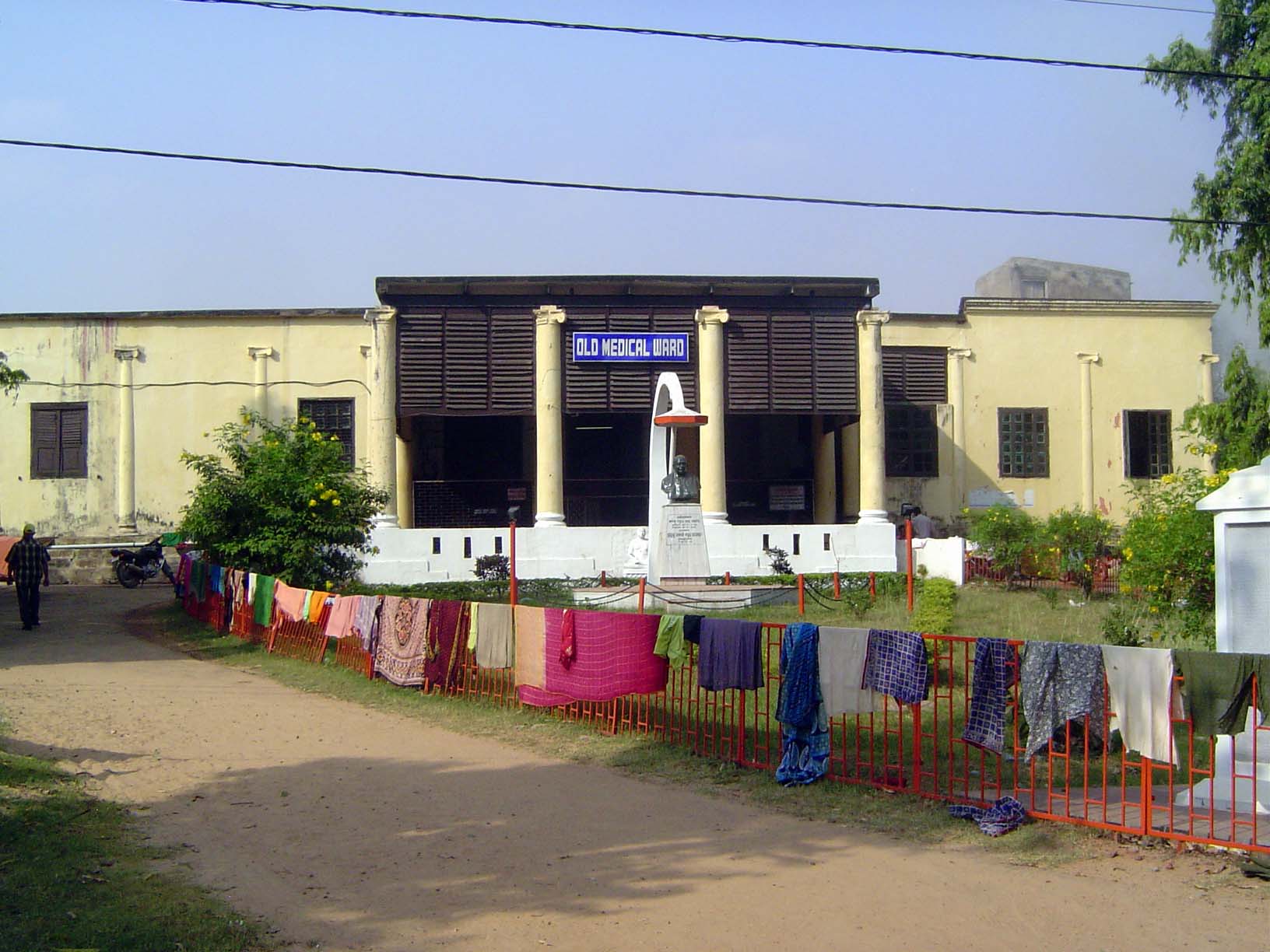The sign says "Old Medical Ward," but the building has a much longer history than that. It sits on the site of the Lalbagh Palace and was oc