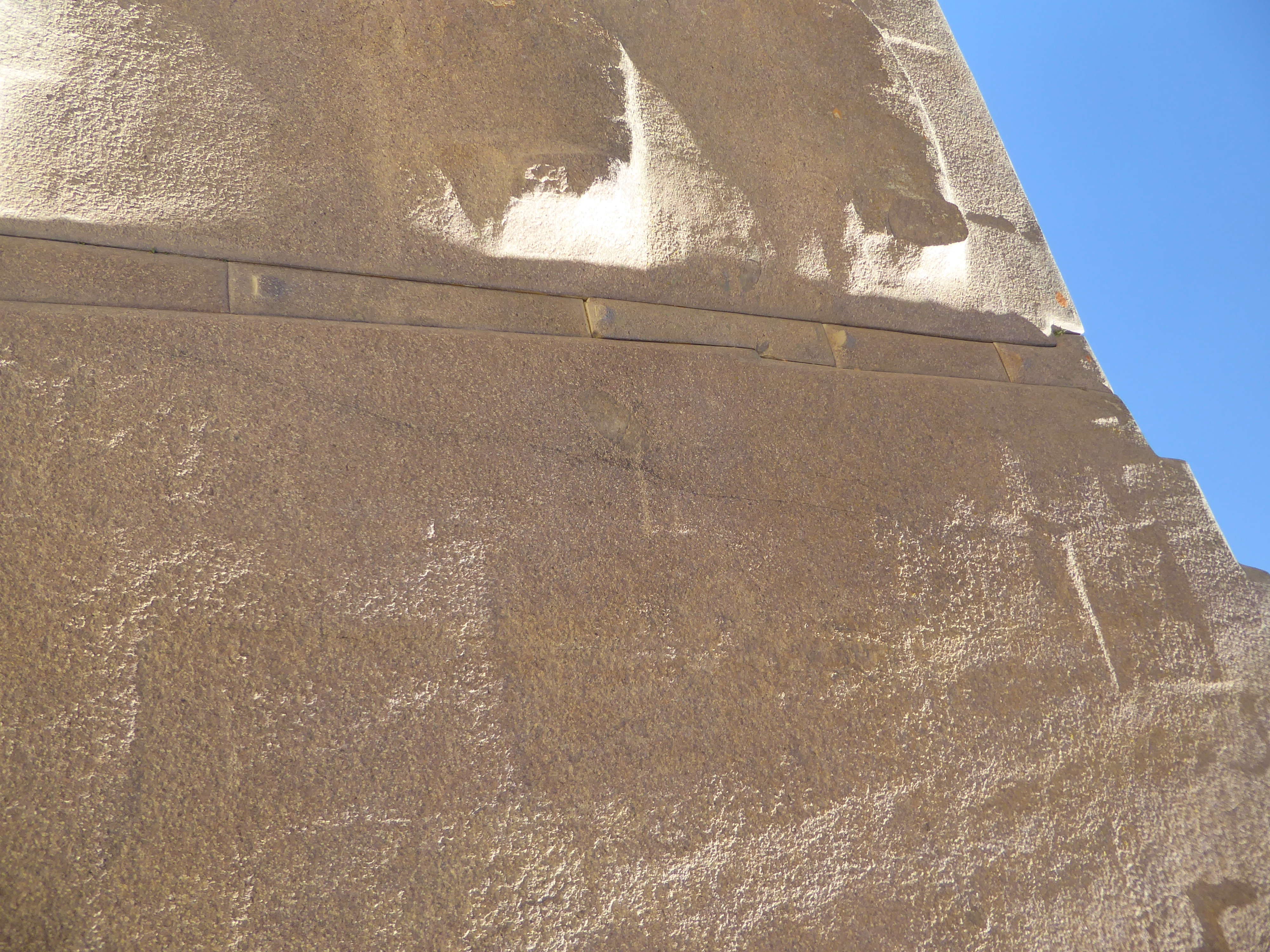 Instead of deeply bevelled edges, here and only here the Inca separated the blocks with stone shims. Why the T-shape on the top shim? Sure,