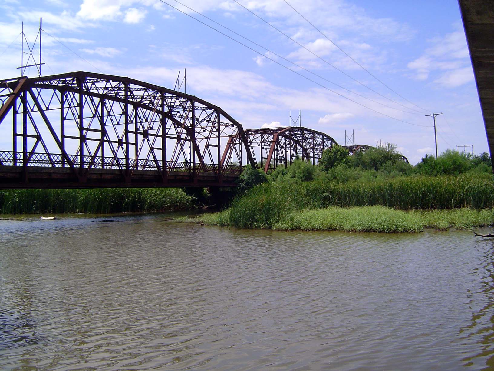 U.S. U.S. 66 crosses the northern end of the reservoir on this old cantilever bridge.