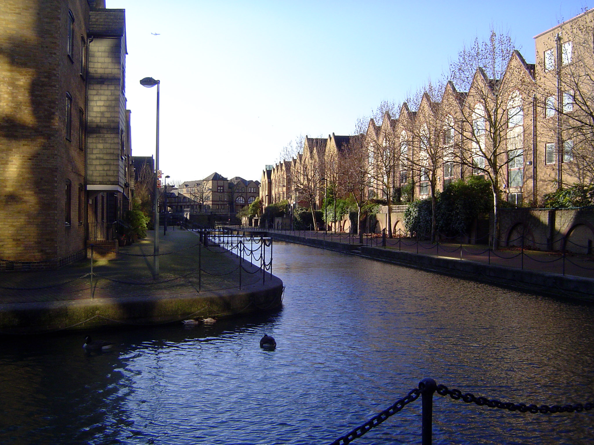 Housing along the same canal. It's a far cry from the 1850s, when Henry Mayhew wrote about these docks: "Along the quay, you see now men wit