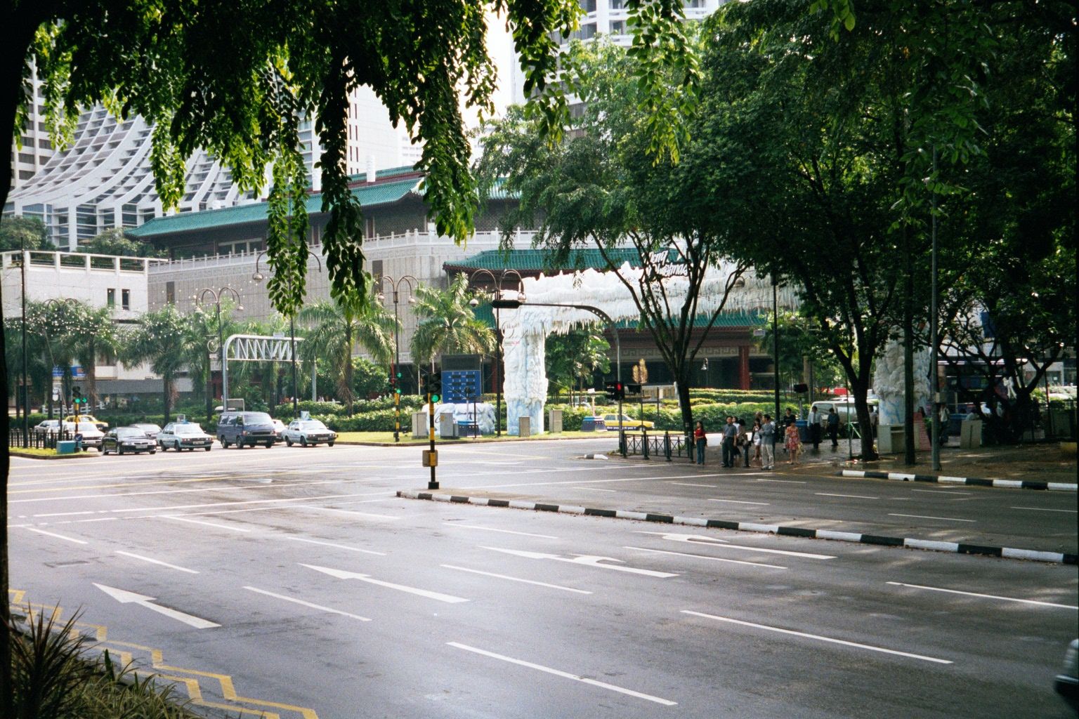 The same leafy corner, from ground level. The trees are no accident. Here's President Lee Kuan Yew, in 1980: "Singapore can become a green,