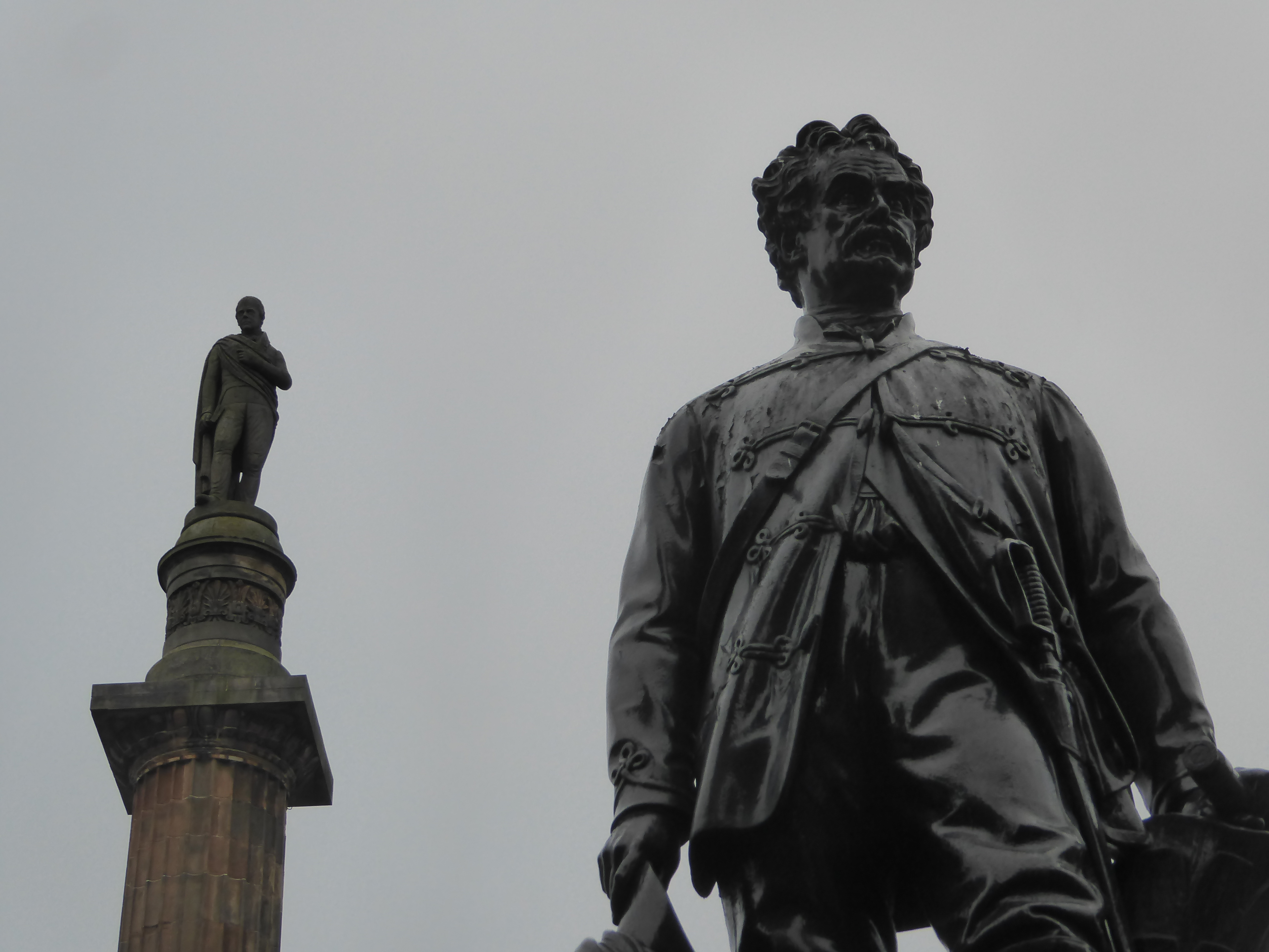 How's this for an unlikely pair? Atop the column, and wondering how to get down, is Walter Scott. He's been there since 1837, five years aft