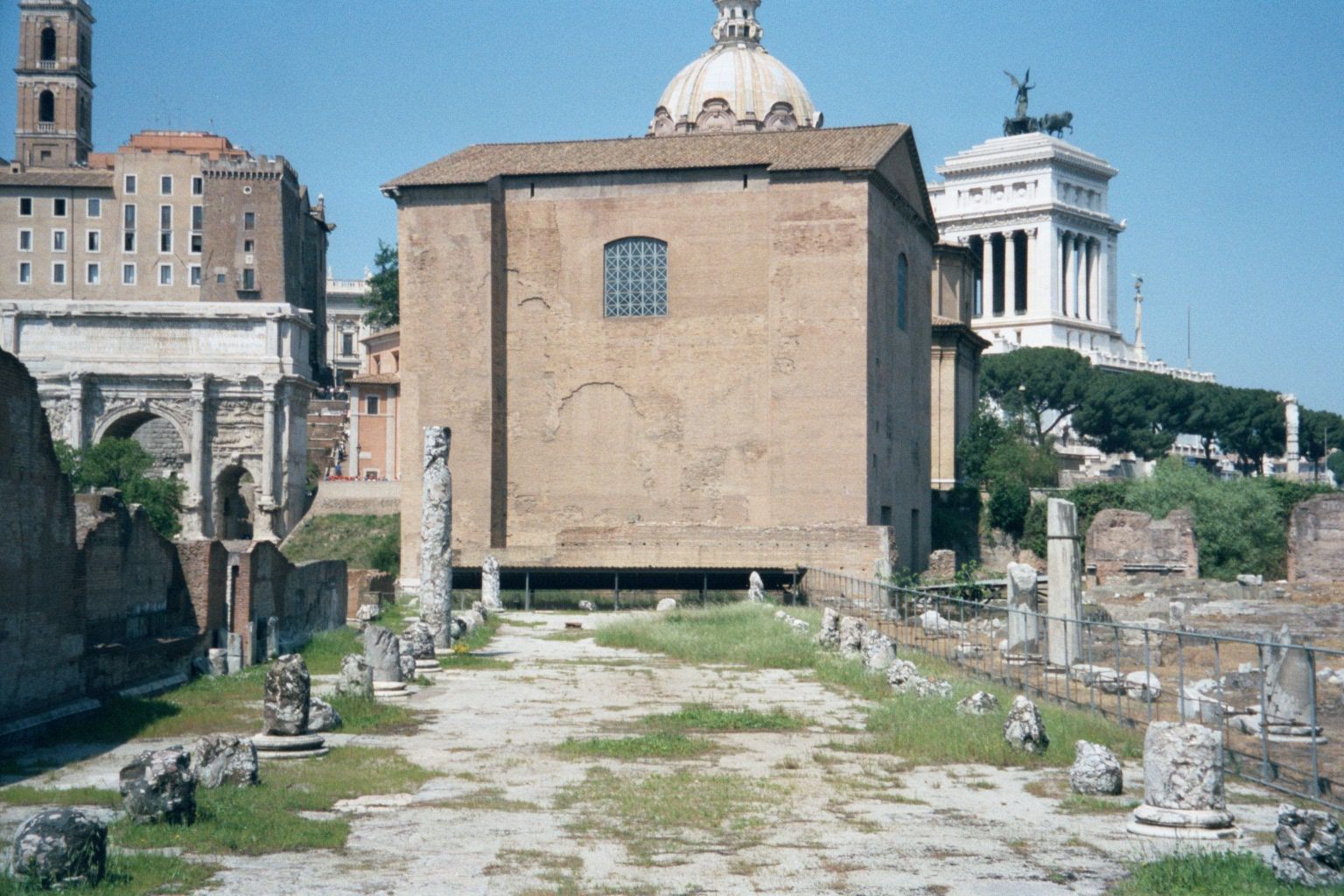 The Arch of Septimius Severus is on the left, bordering the severe brick Curia, or senate house, built by Domitian and restored by Diocletia