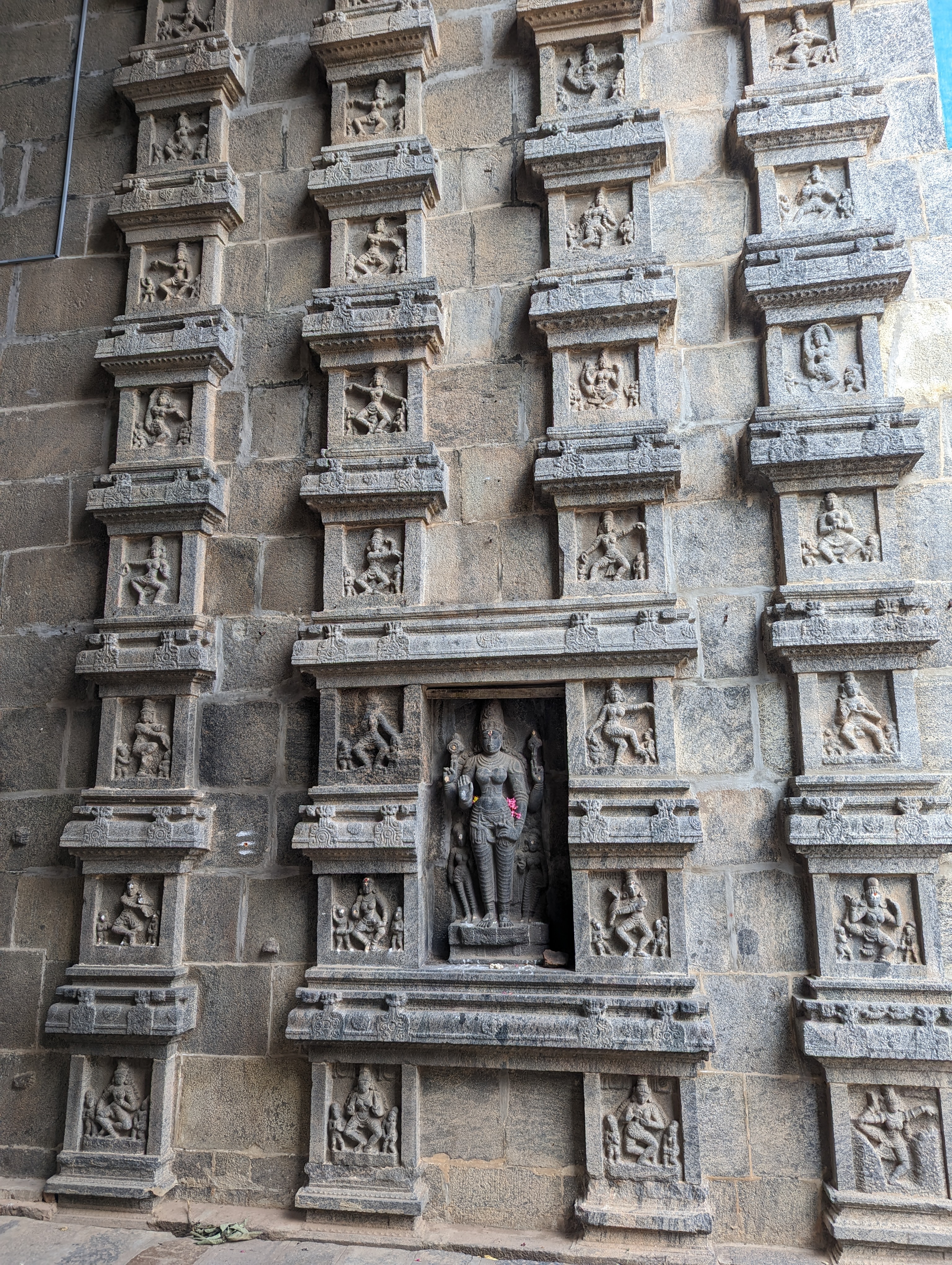 Ornamented pillars in the passage.  This temple celebrates Nataraja, or Shiva as the Lord of the Dance.