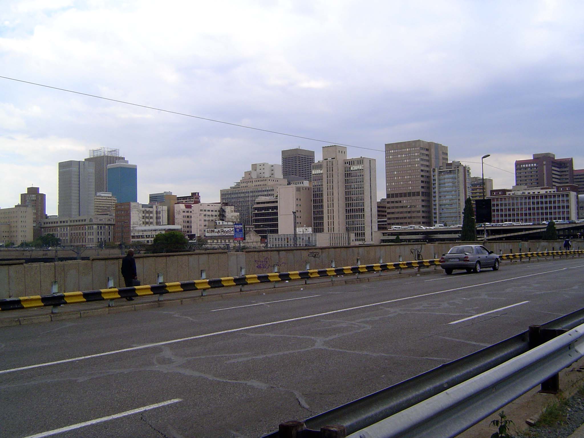 The view of the CBD from the none-too-regal Queen Elizabeth Drive as it passes over a wide set of railroad tracks.