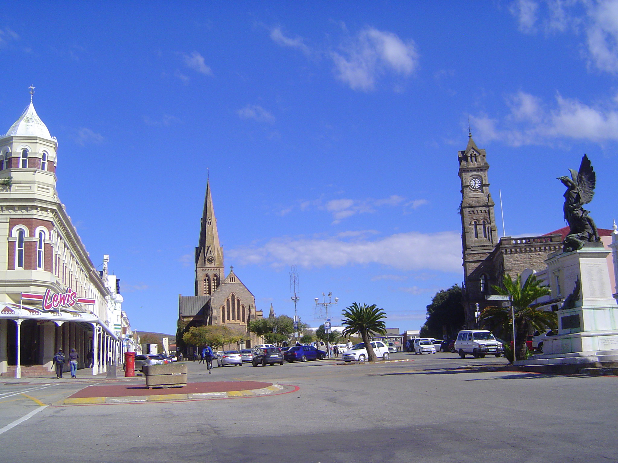 The view grows somber with the dark Cathedral of Saints Michael and George and the town hall. Its clock tower was conceived as a memorial to