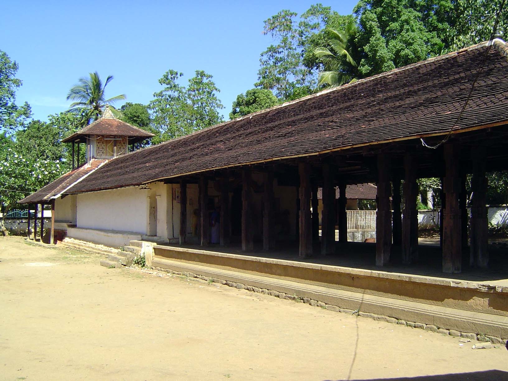 The shrine at the rear is closed: few villagers have ever seen the image within it of Kataragama. In the foreground is a ritual hall, or dig