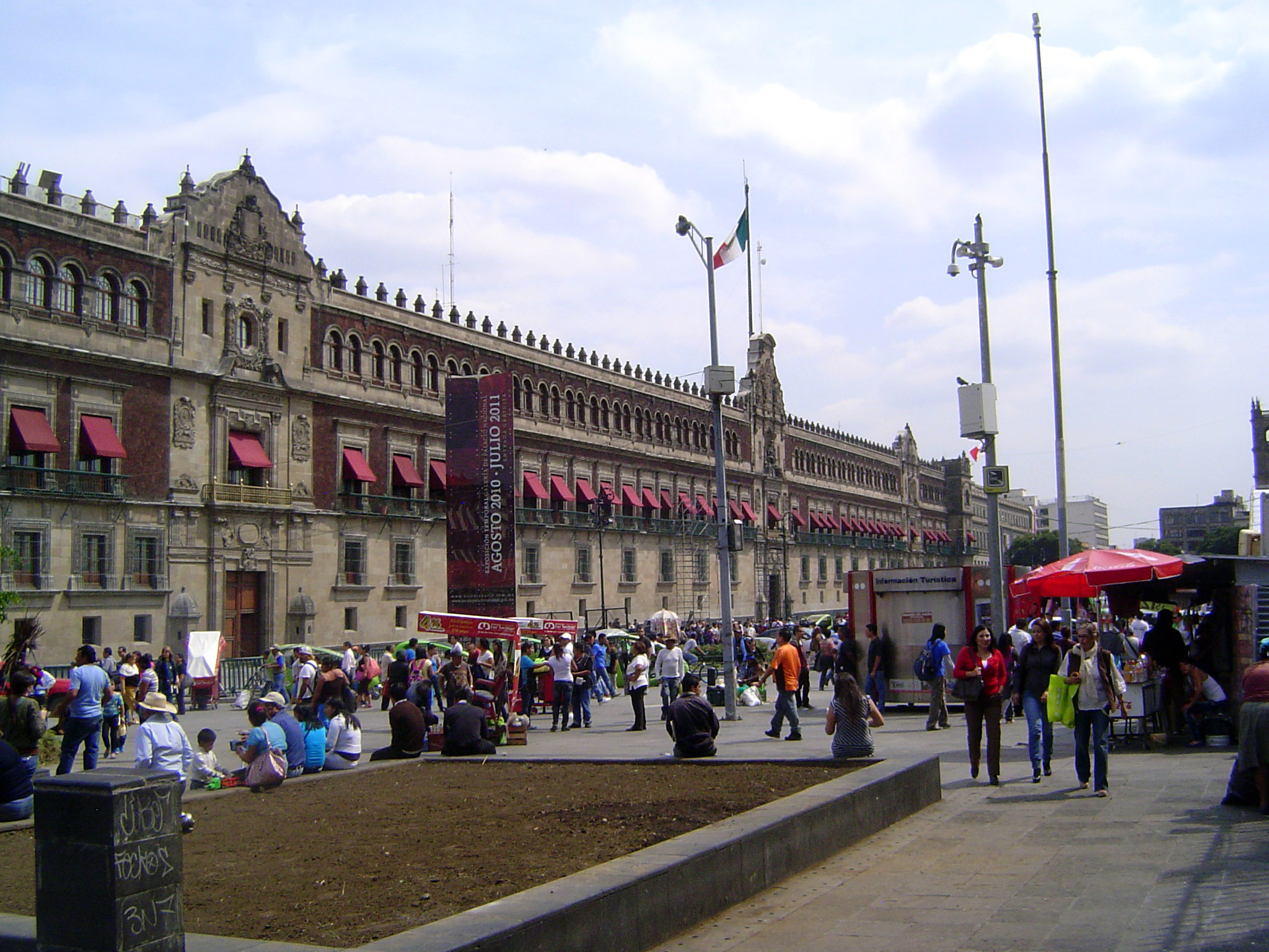 The National Palace, on the east side of the square, occupies the site of the residence of Cortés. Sold to the Crown in 1562, the building b