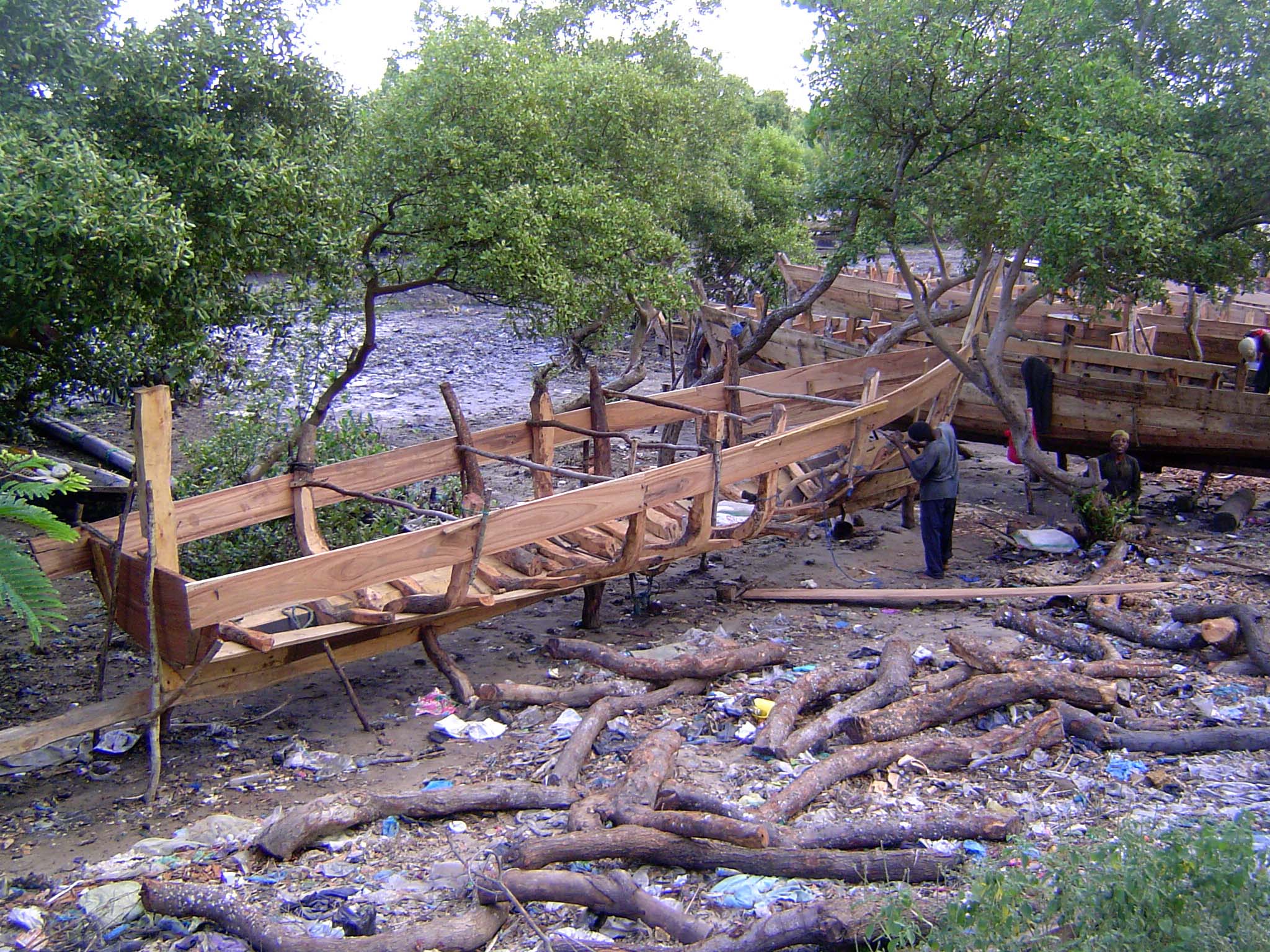 How about now? It's a dhow shipyard, and the men use no power tools, no power saws even. Everything's done the old way.