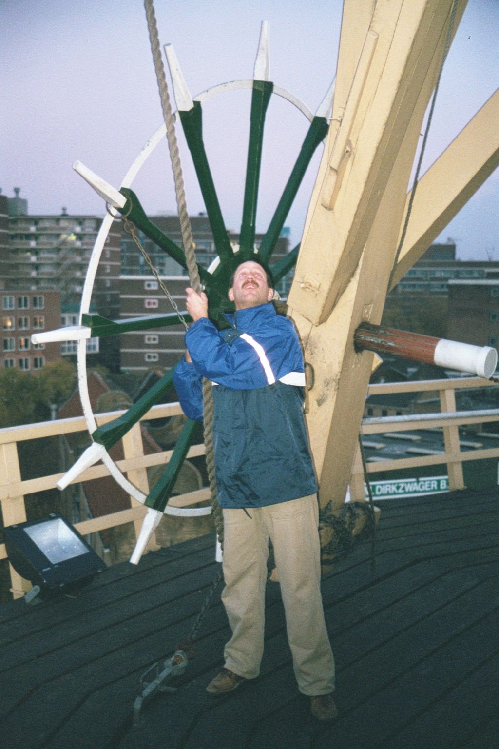 Practicing sailing? Well, yes, in a way. He's getting ready to furl the sails at day's end.