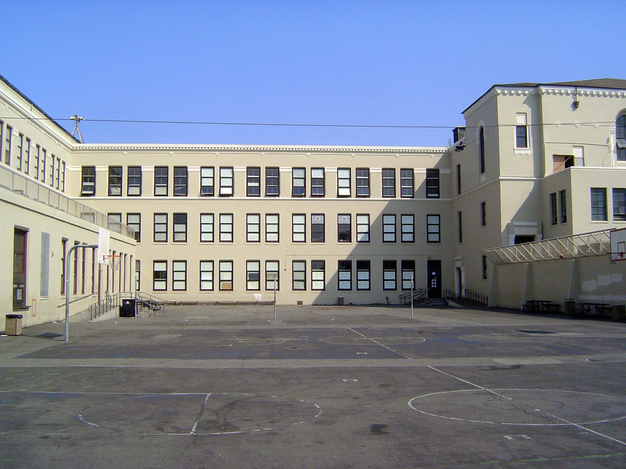 The main school yard, with the so-called "tunnel" hidden at the upper left and leading inside. The room at the upper right, before the wing