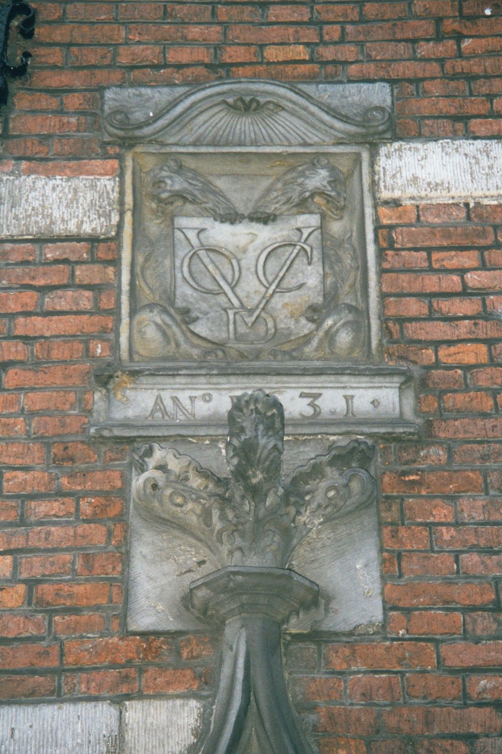 Street level on the same building has a plaque with the initials VOC:D. Translation: United East-Indies Company: Delft Chamber. The VOC's ot