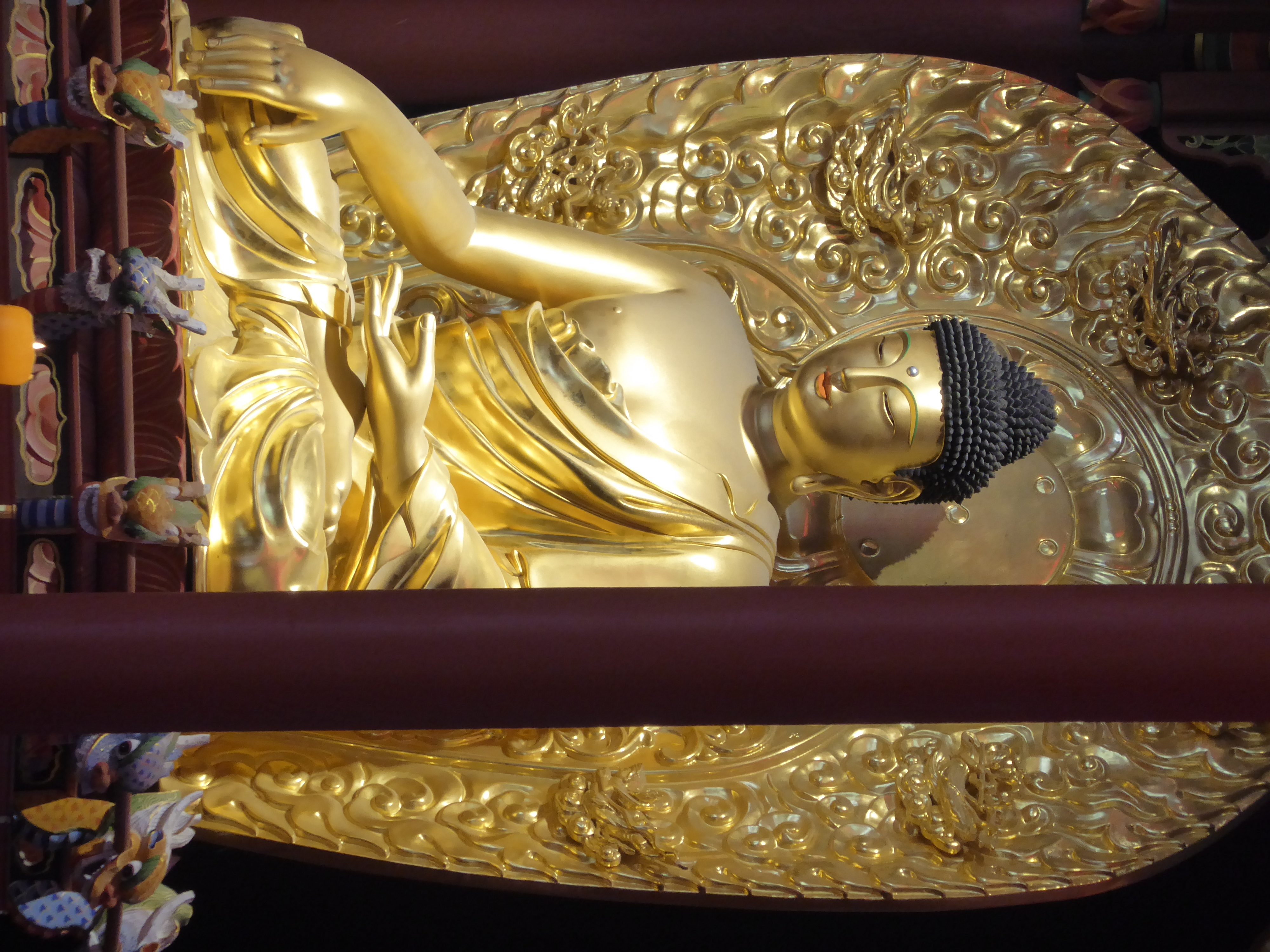 It can't be very old, either. The stylized position is the mudra called Bhumisparsa, the moment of enlightenment.