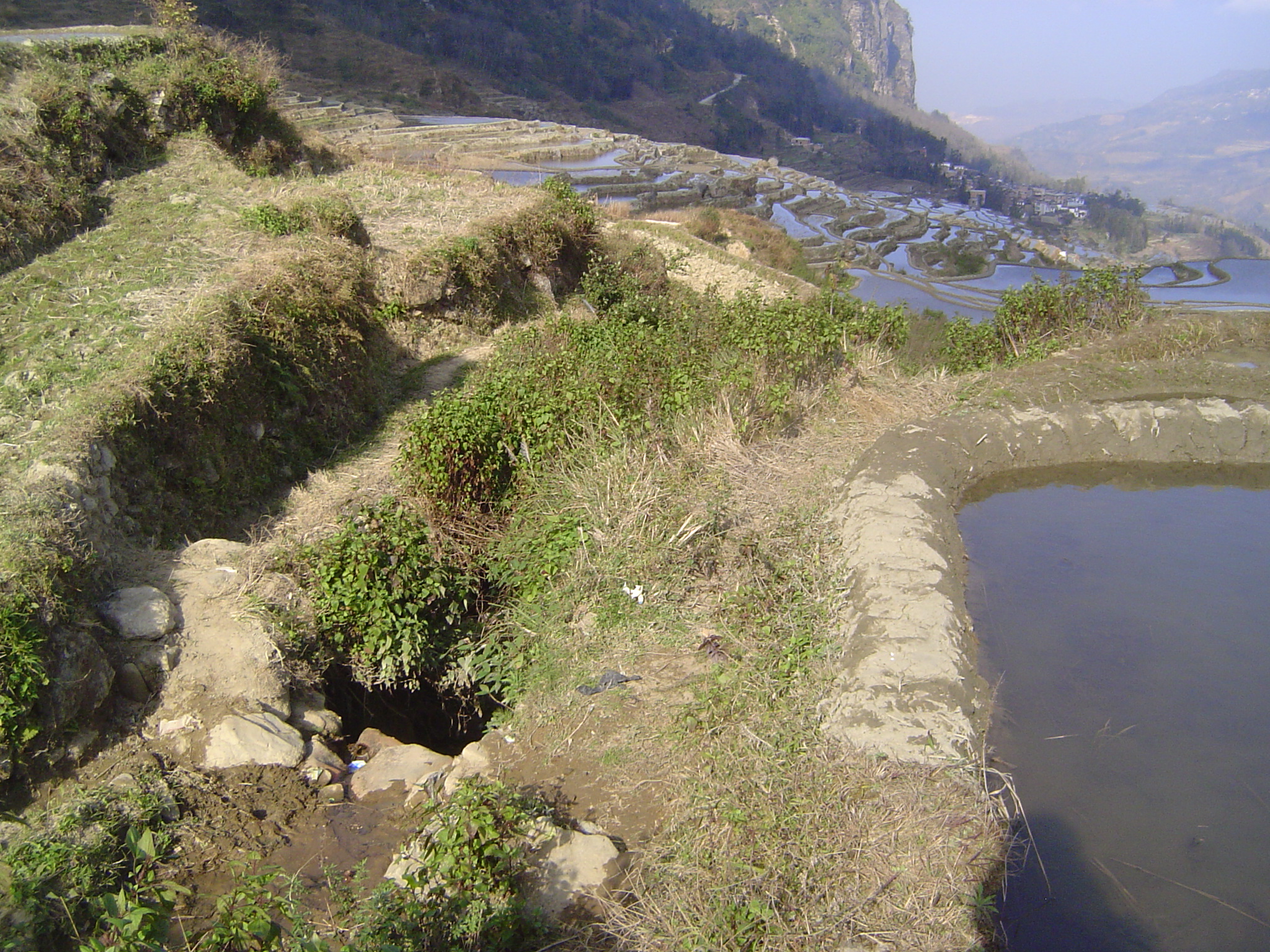 The main channel drops. The path stays on its left.