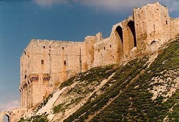 The ancient citadel of Aleppo, dating in this form from about 1200, when it was rebuilt by Ghazi, son of Saladin. Its present ruin dates to