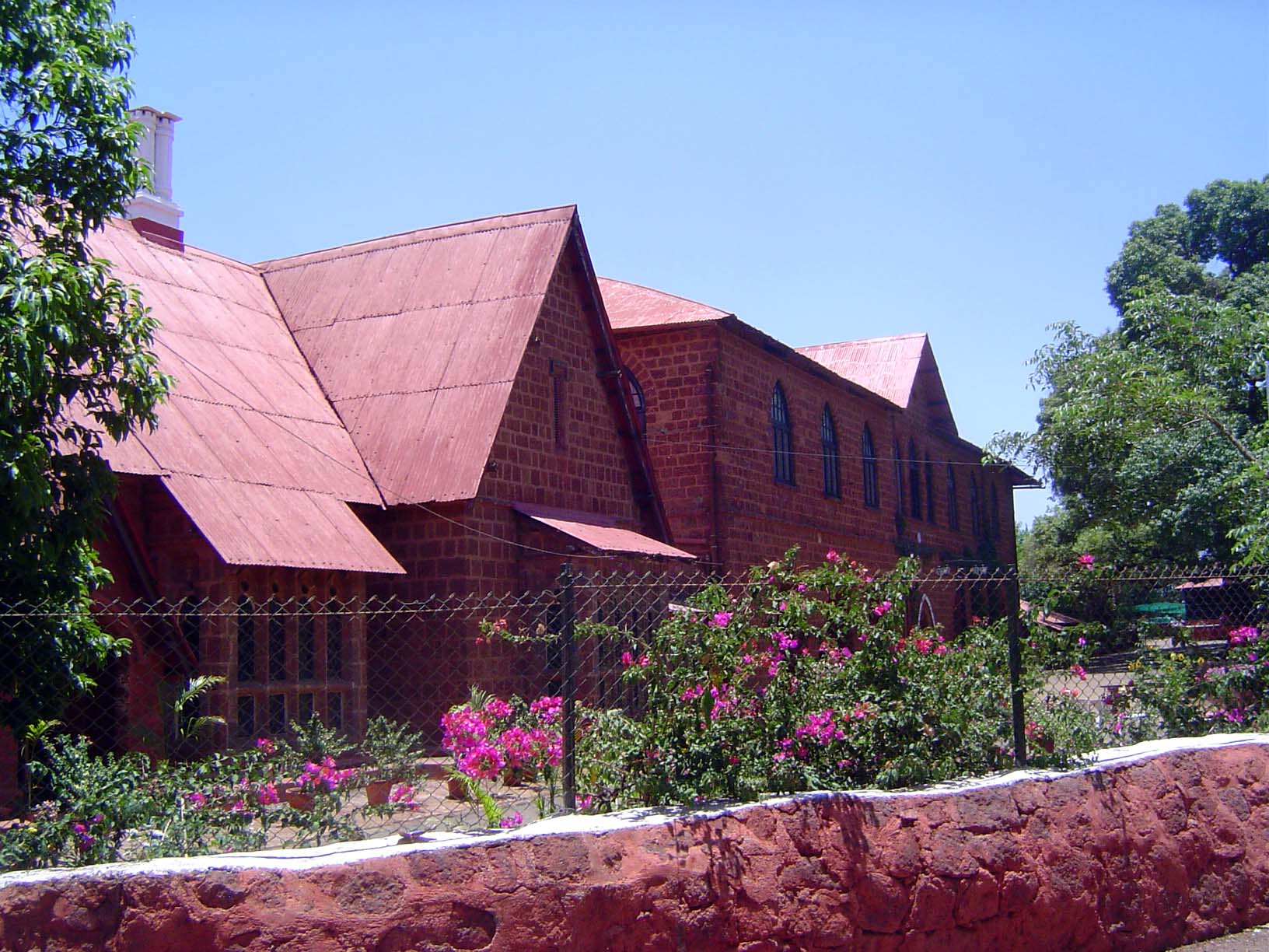 Mahabaleshwar began as Malcolm's army sanitarium. That was 1828. Fifty-some years later, the sanitarium, on the right here, and Bartle Hall,