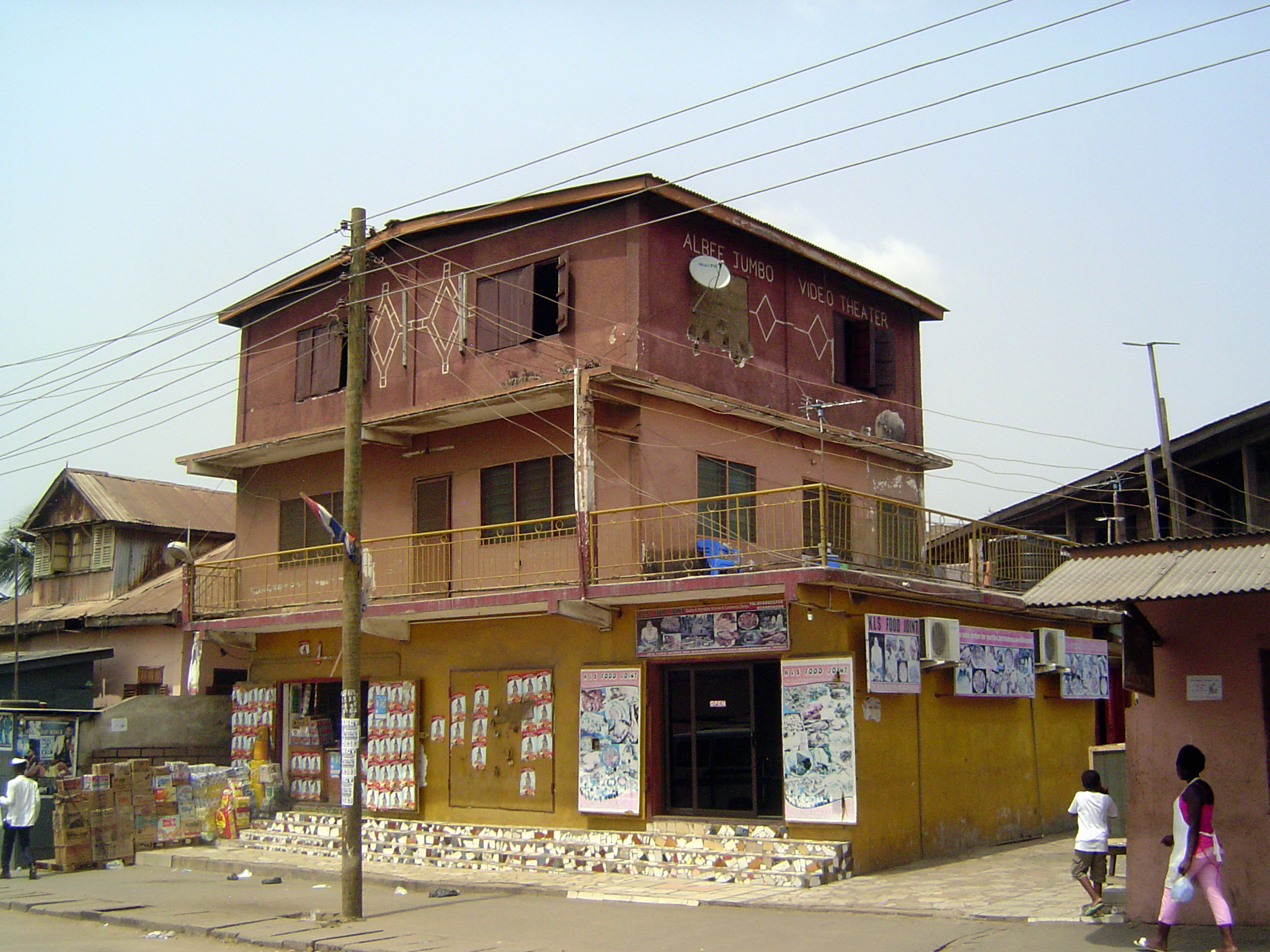 Its neighbor: stacked blocks, with shops below.