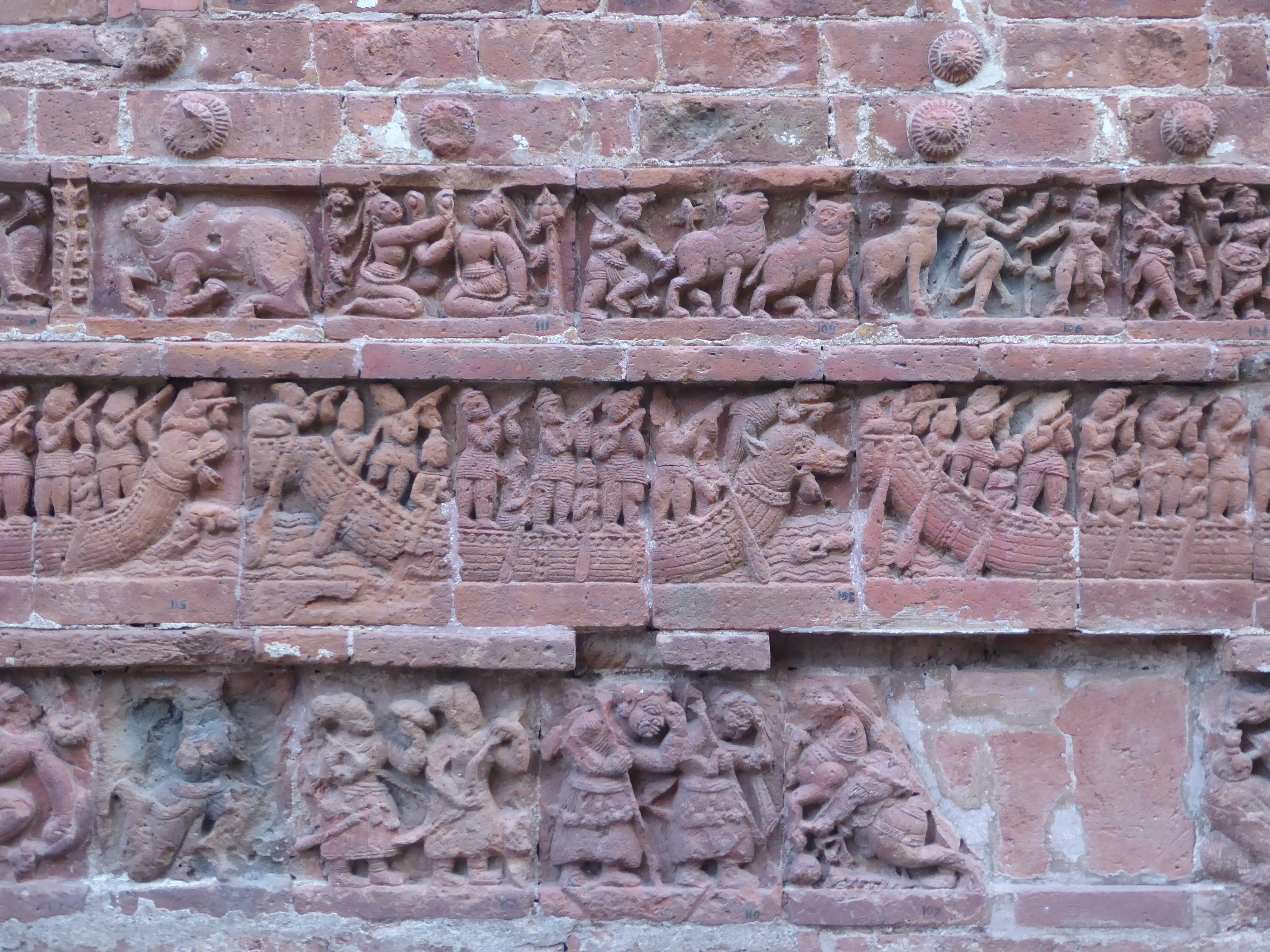 Time for the wider world. Ghosh writes that "ships with animal-headed prows evoke that international maritime trading activity on the temple