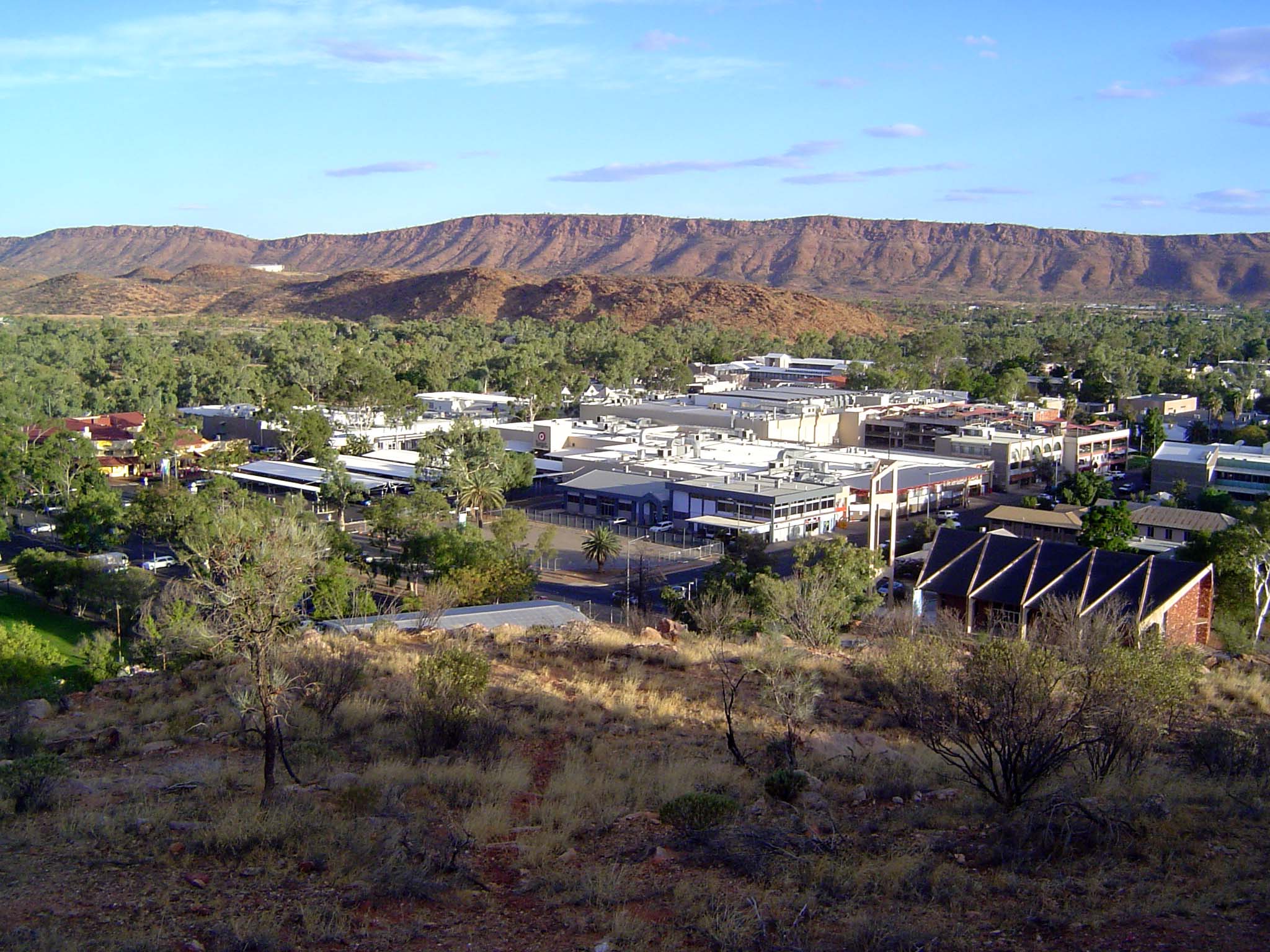 Enough frippery. We've come to town and climbed Anzac Hill. The view is south over the town center, with the MacDonnell Ranges in the backgr