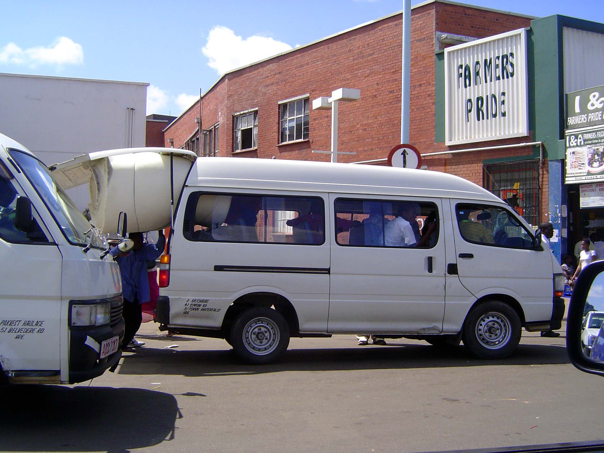Parts of the city are almost as crowded and a lot more lively. Here, minivans leave for surrounding villages; one turns into a moving van fo