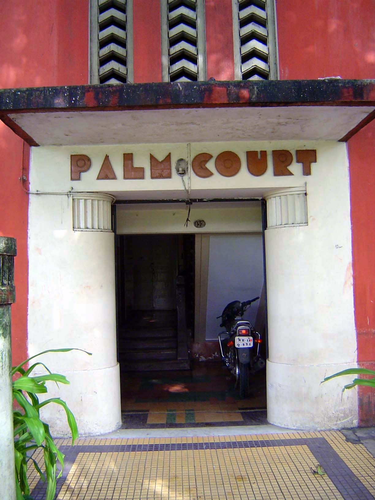 Palm Court, at 152 Queens Road, is from 1933-30 and was another building by Gajanan B. Mhatre. The entrance is magnified by color and bold c