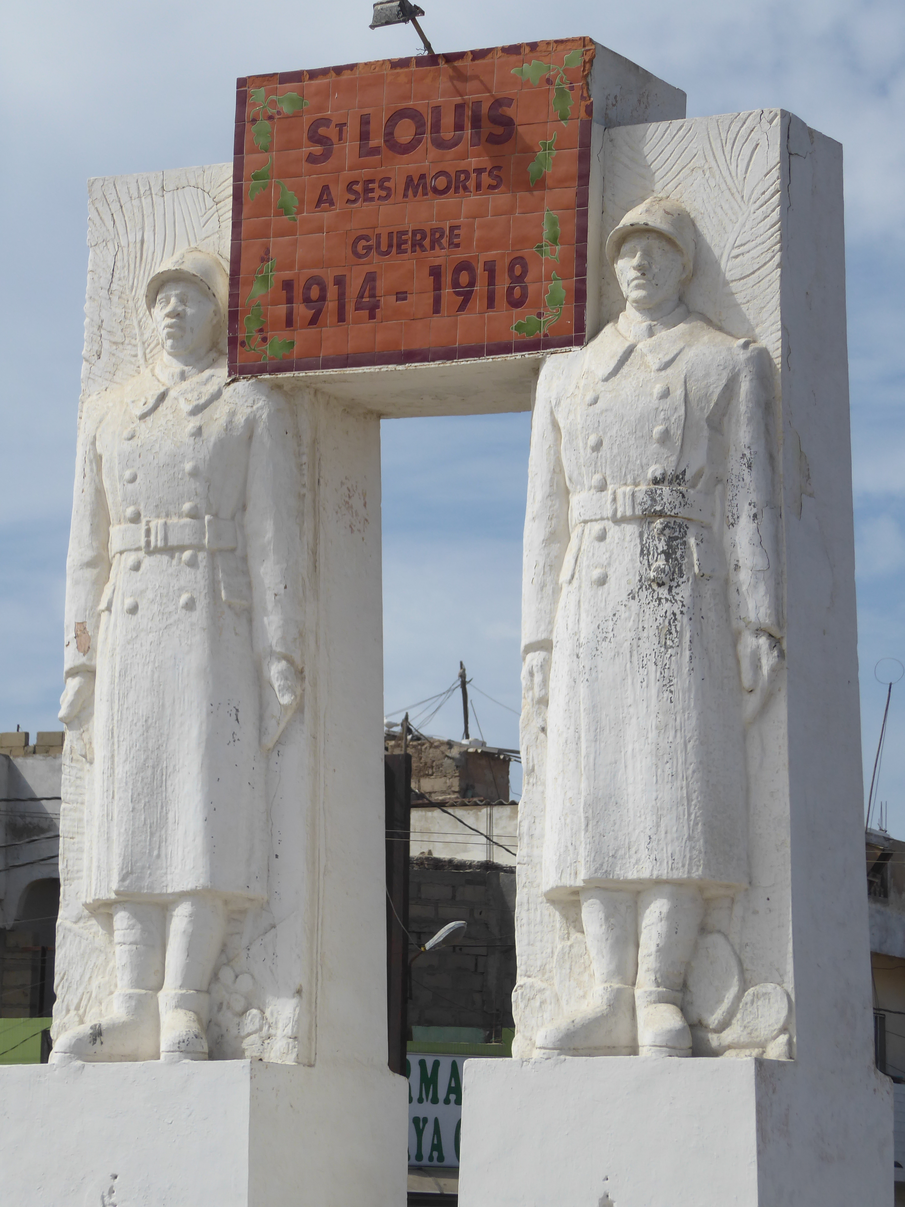 No plaques or insignia but the imagery of French-and-Senegalese-together recalls the Demba and Dupont statue in Dakar.