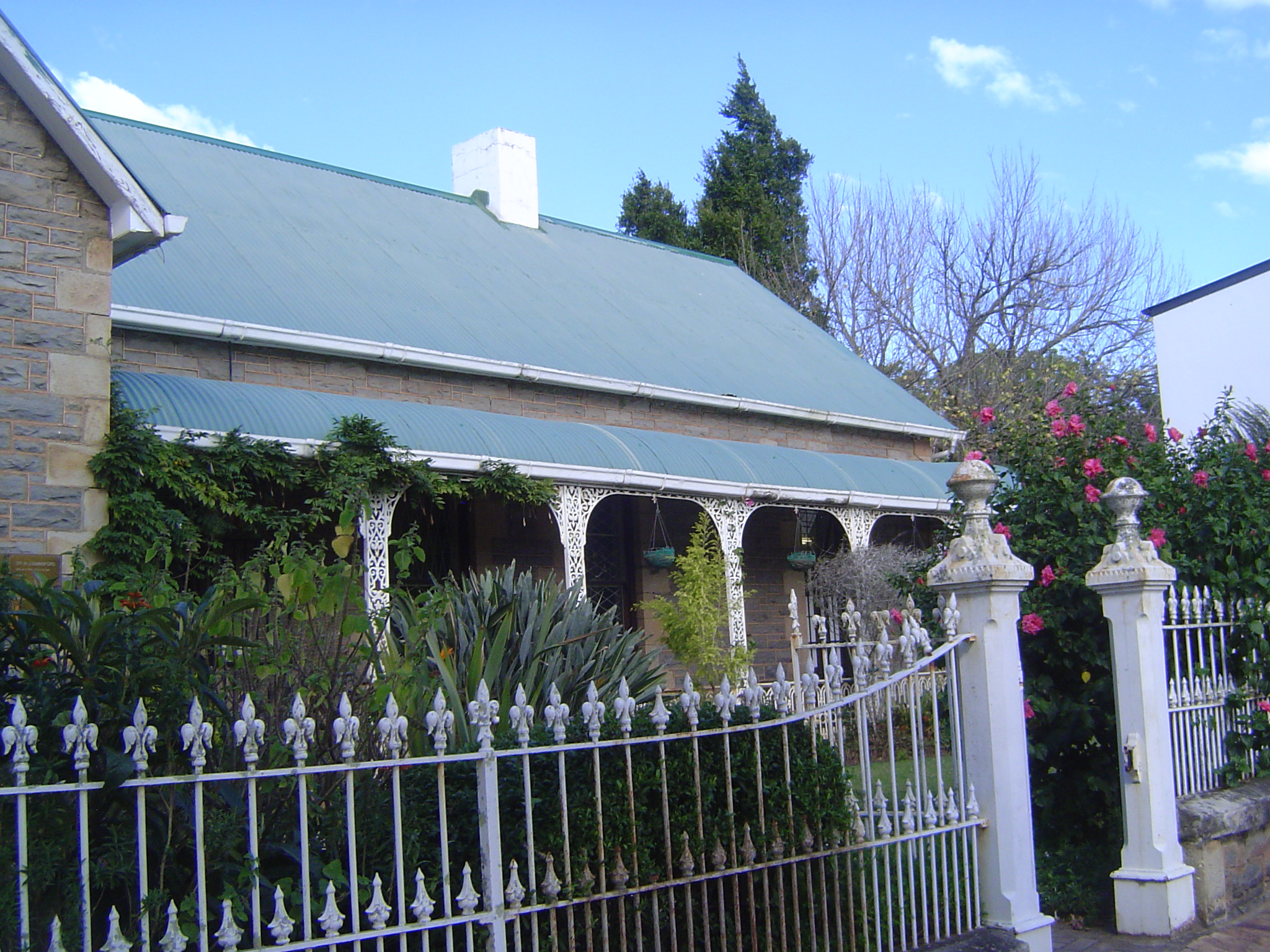 By the time of the university's founding, Grahamstown had plenty of nice houses. Here's one, probably with imported cast-iron fencing.