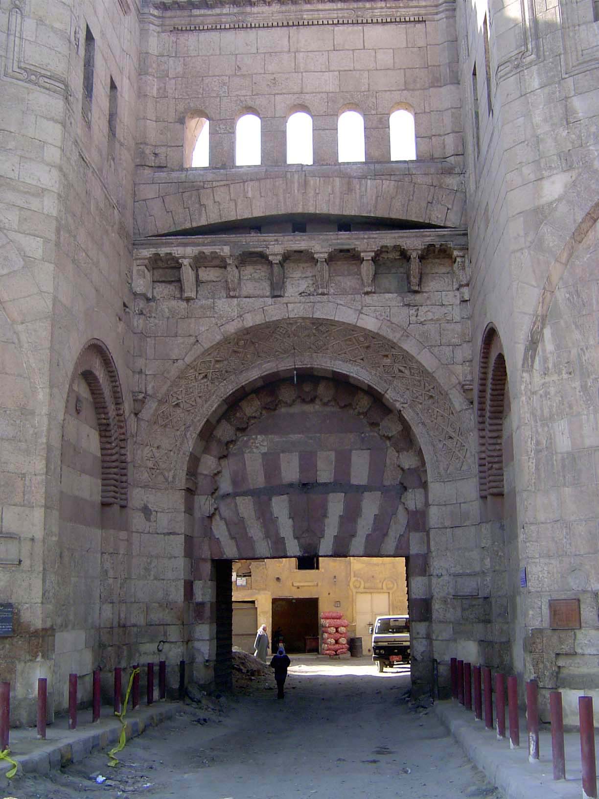 No. 6 The Bab al-Futah, "The Gate of Conquests," has round flanking towers instead of square ones. It's also the main entrance to the axial