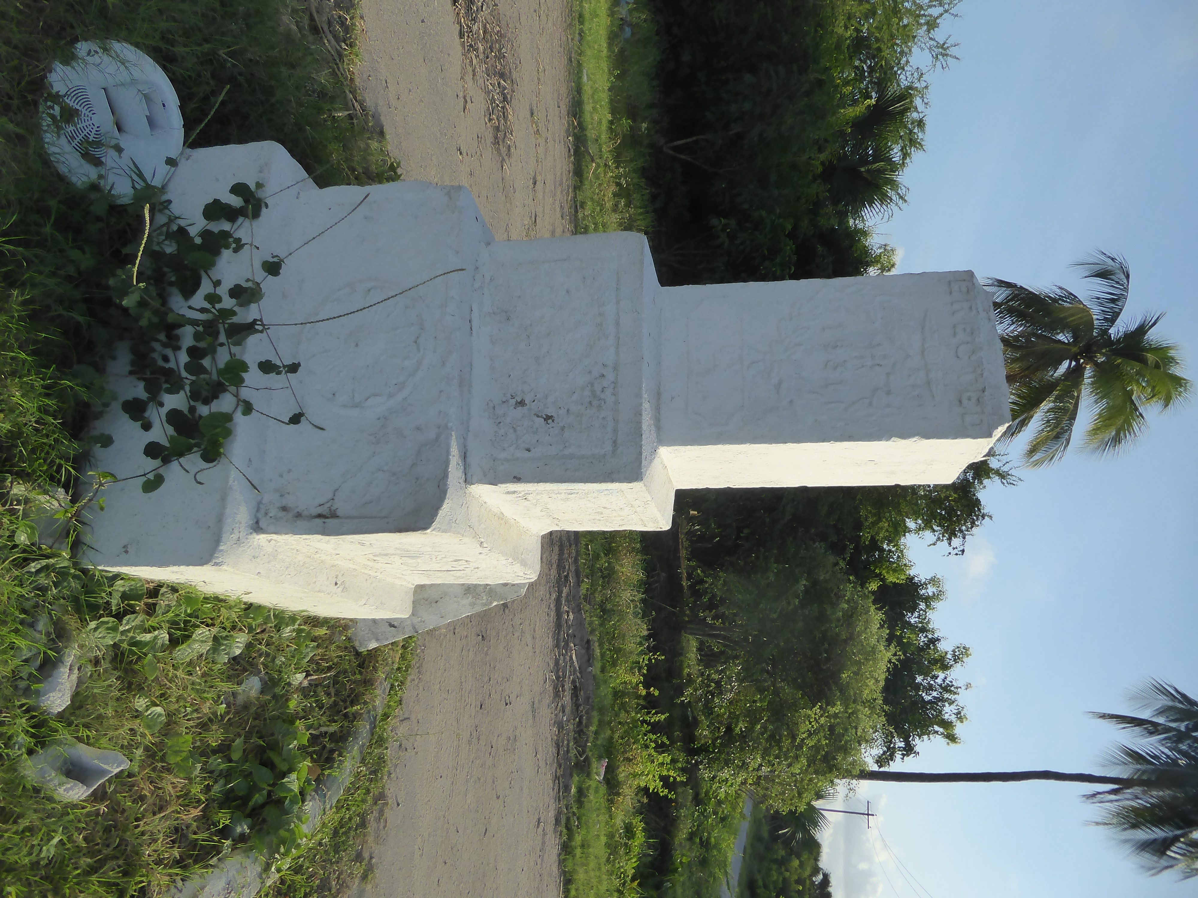 Near a crossroads in the cemetery, there's one of the few freestanding monuments. It's almost illegible but is clearly dated 1931 and was ap