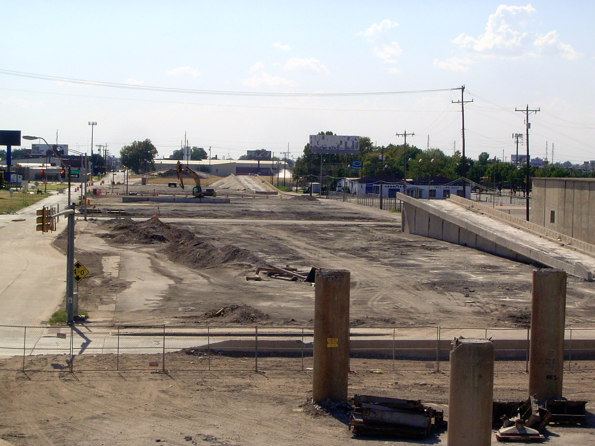 Soon the columns bite the dust. A new street-level boulevard is to replace the old highway.