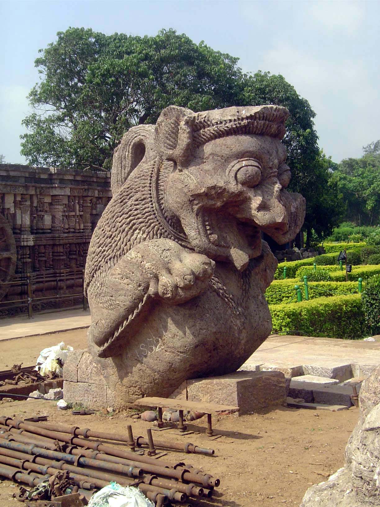 A colossal but fragmentary lion.