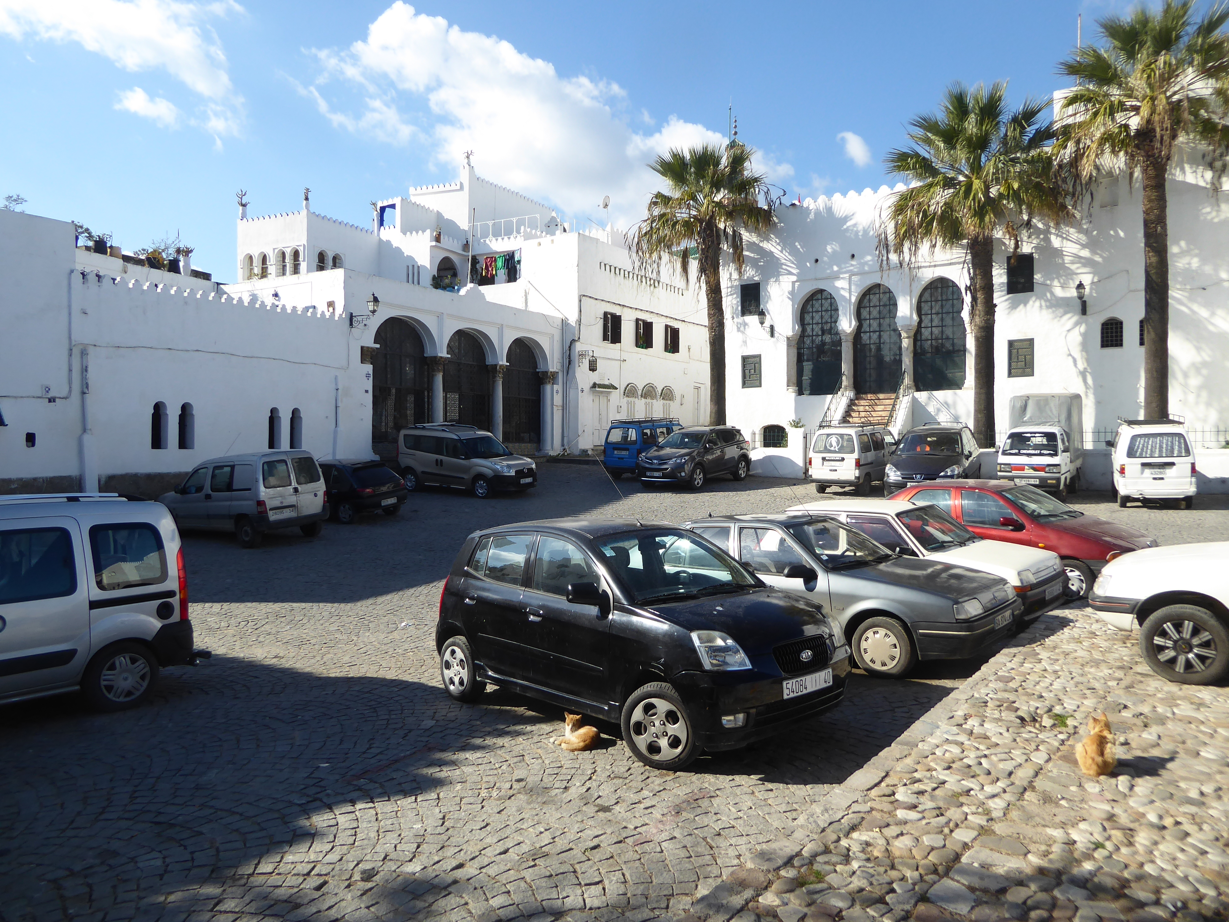 The perfect paint job is a tipoff. We're in the car park that used to be the parade ground of the sultan's palace. It's called the Place du