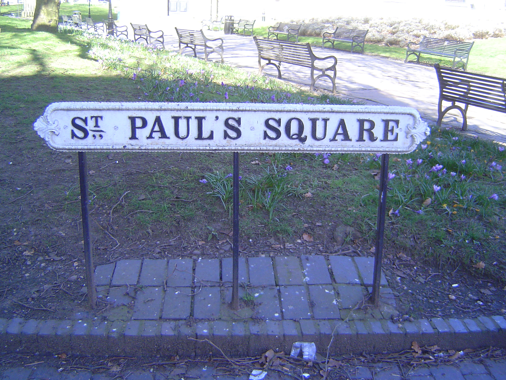 The square is said to be the city's only true Georgian square, neatly rimmed with three-story houses. The sign is of cast iron. It's heavy a