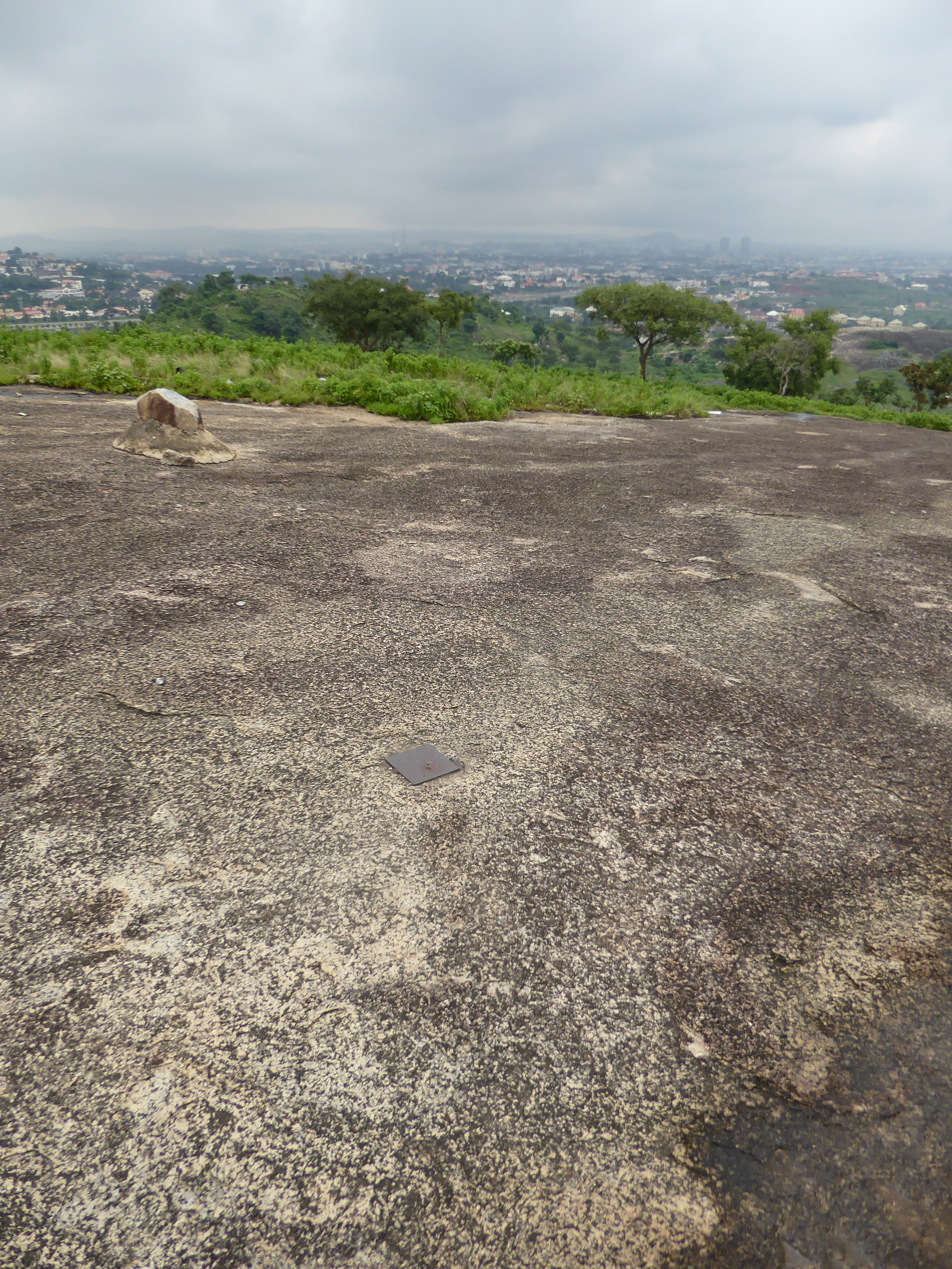Climbing Aso Rock is out of the question, but here's one that's easy: Katampe Hill. The brass monument is said to mark the geographical cent