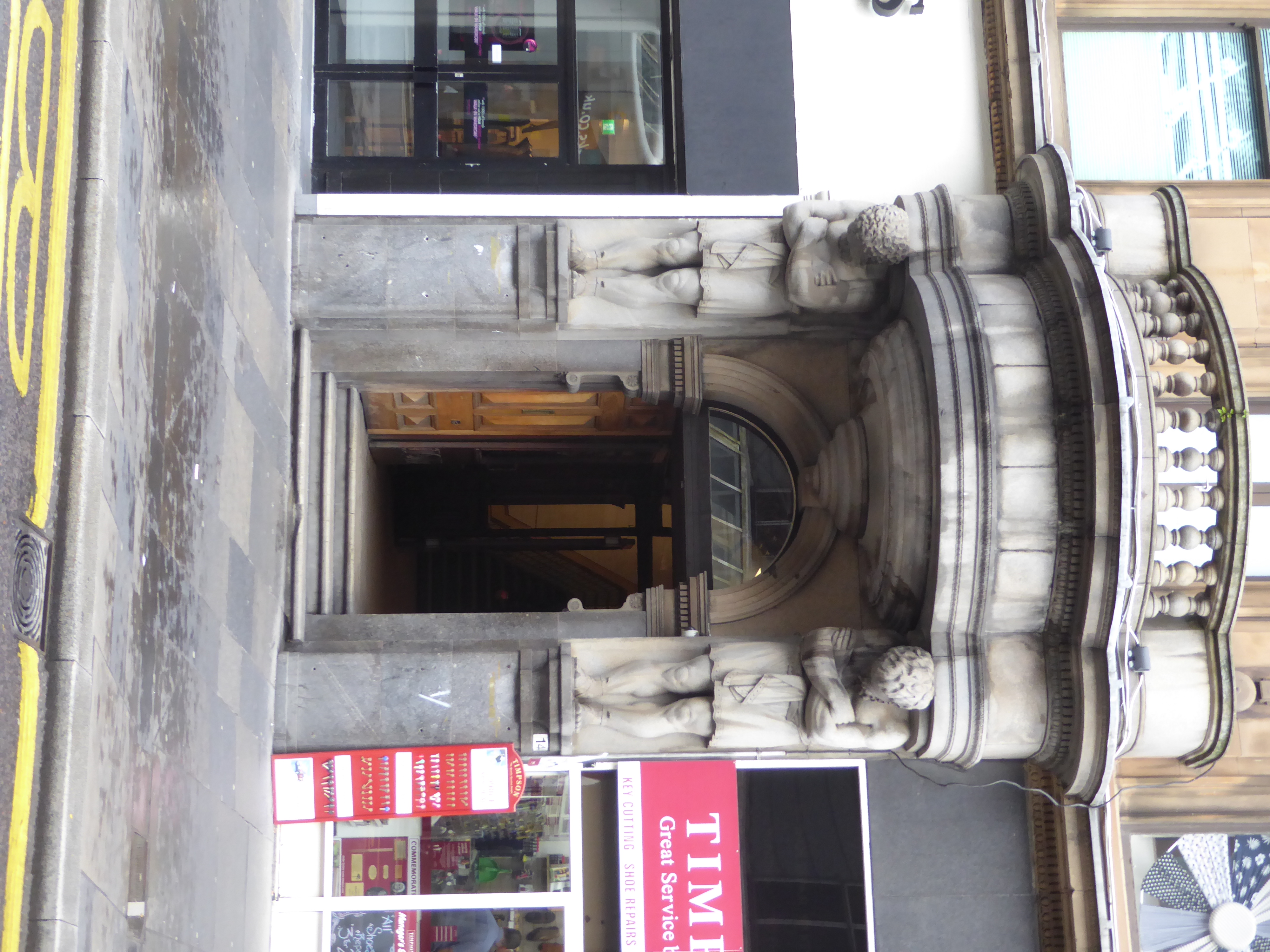 Speaking of ponderous, what did William Vickers have in mind when he, the sculptor, put these Atlantes at the doorway? Cruel and unusual pun