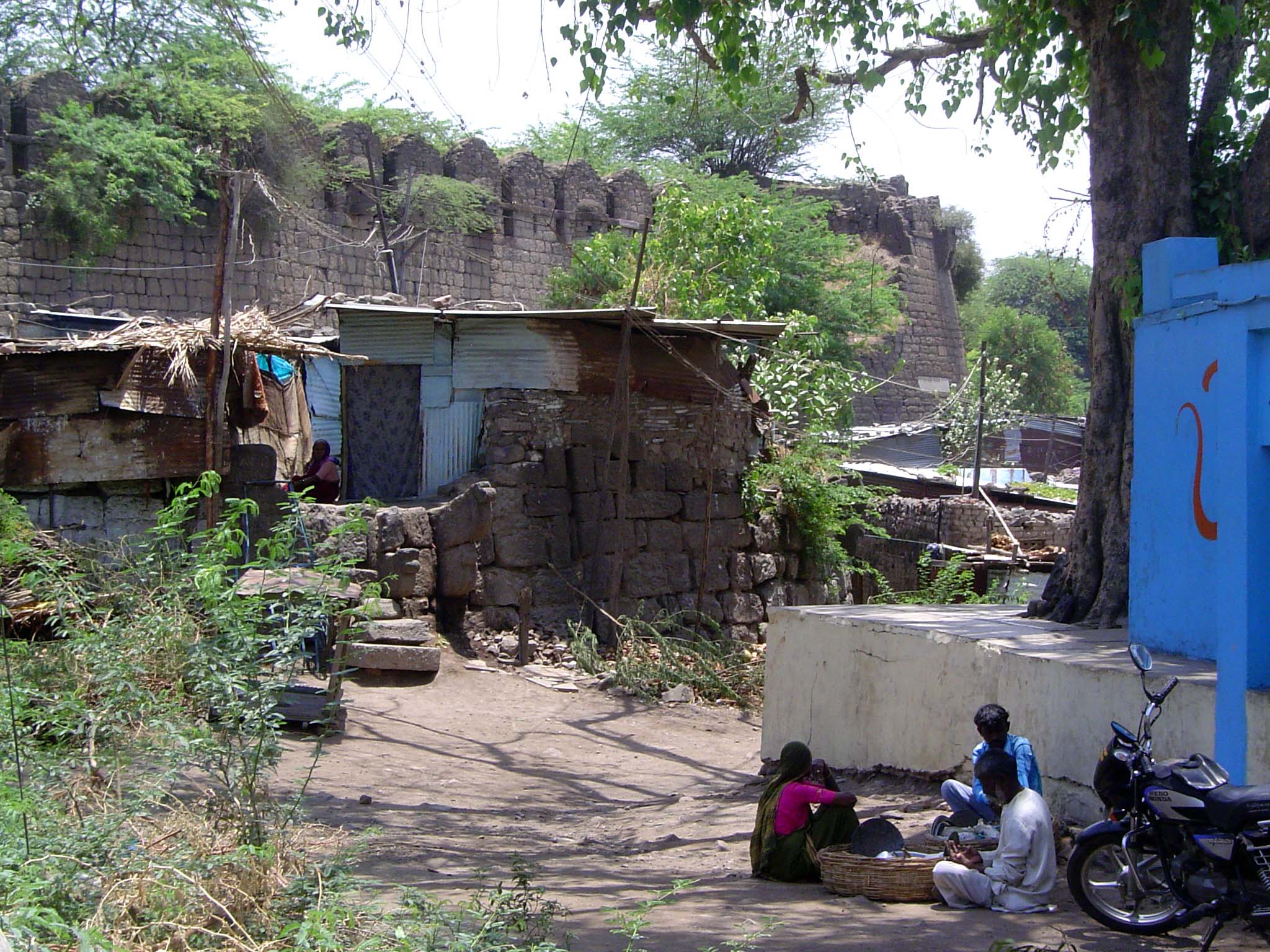 The city wall, six miles in length, had an accompanying, 50-foot-wide moat. Squatters have taken up residence on the spot.