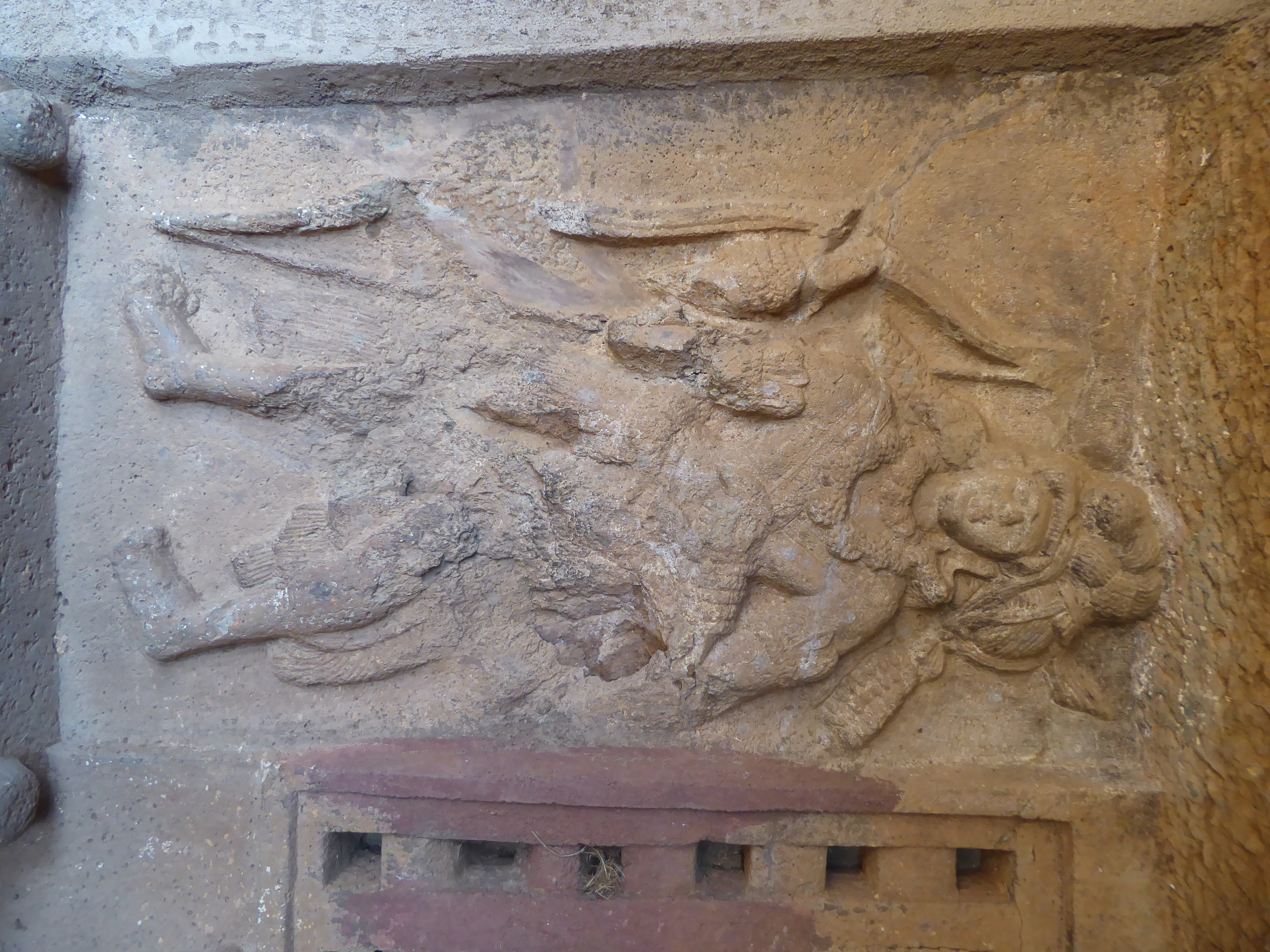 Another figure in the group.
