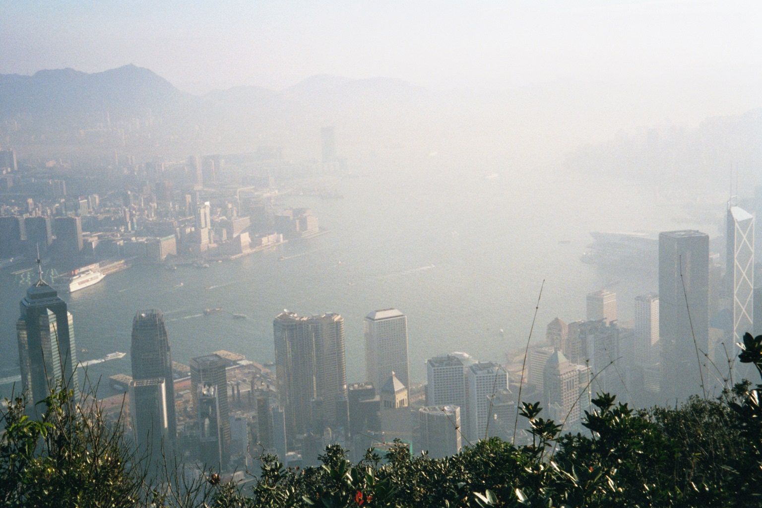 Then, the Star Ferry pier and Victoria Harbour, fairly lost in the smog. Photographs from the mid-1920s show nothing in Hong Kong higher tha