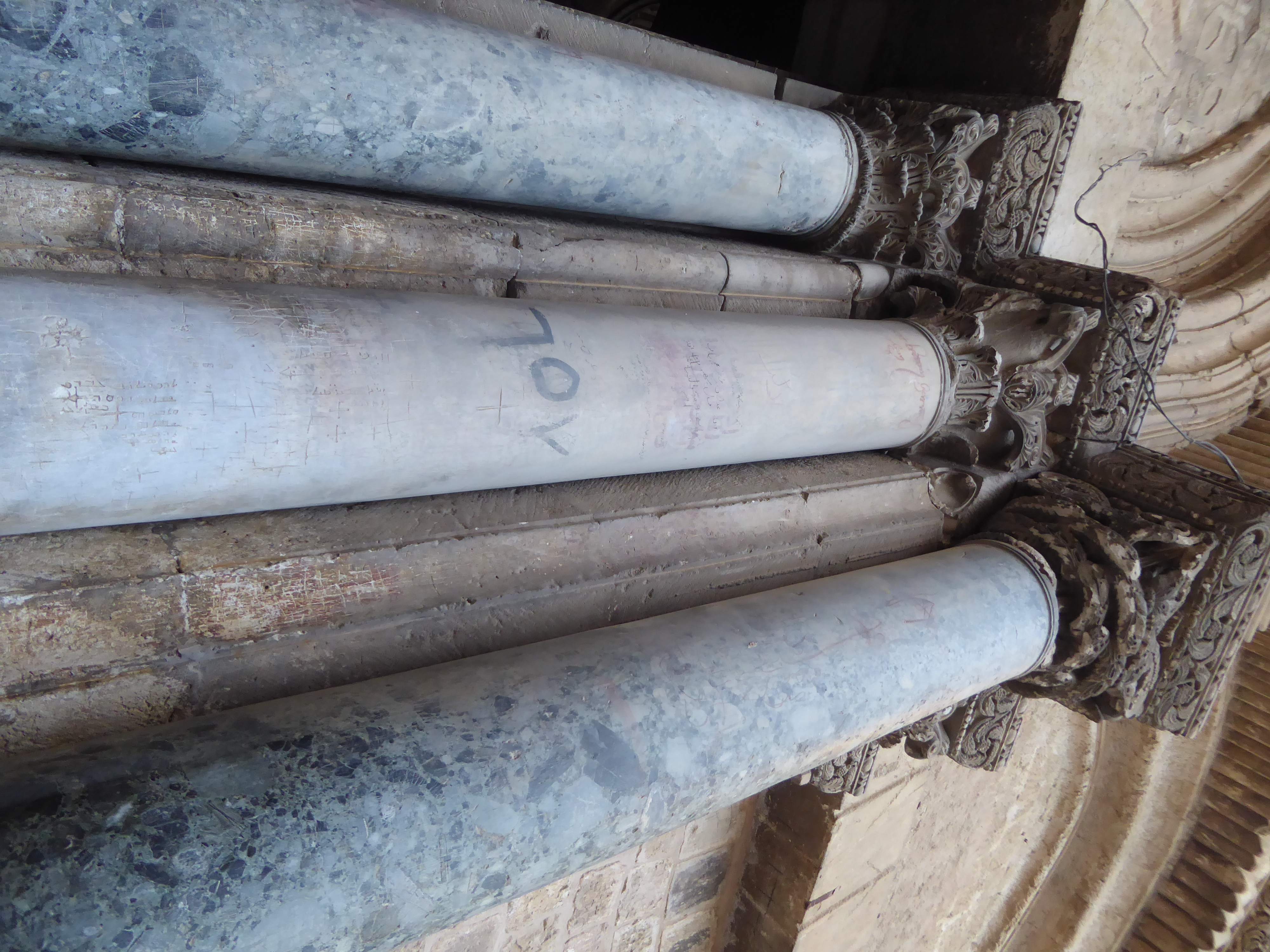 Never mind the crowds in the courtyard outside the Church of the Holy Sepulcher. Just touch the columns flanking the door.