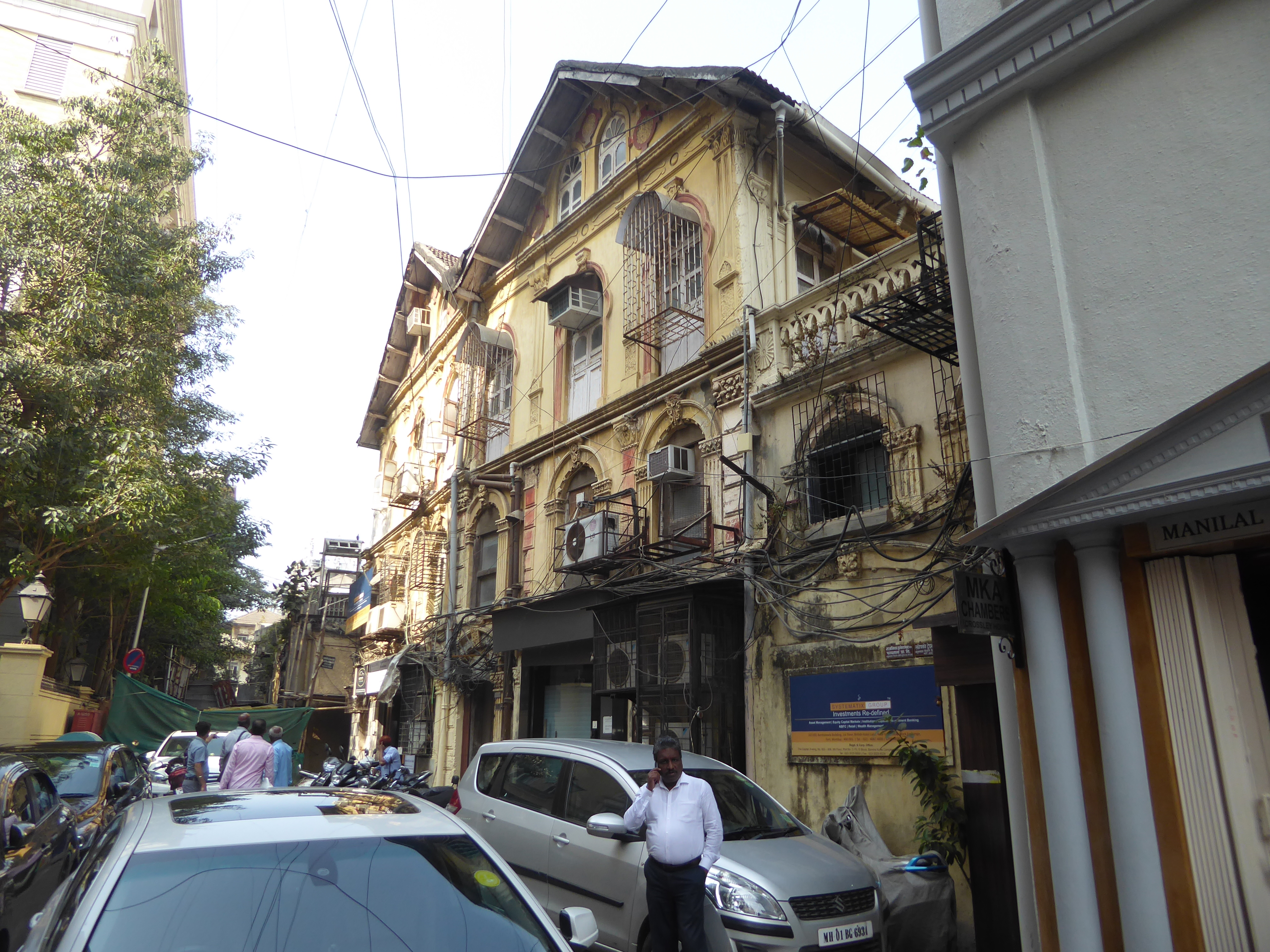 Here's the same building, which is classified as a heritage structure. Bad enough for bicycles; how cars get in and out is a mystery.